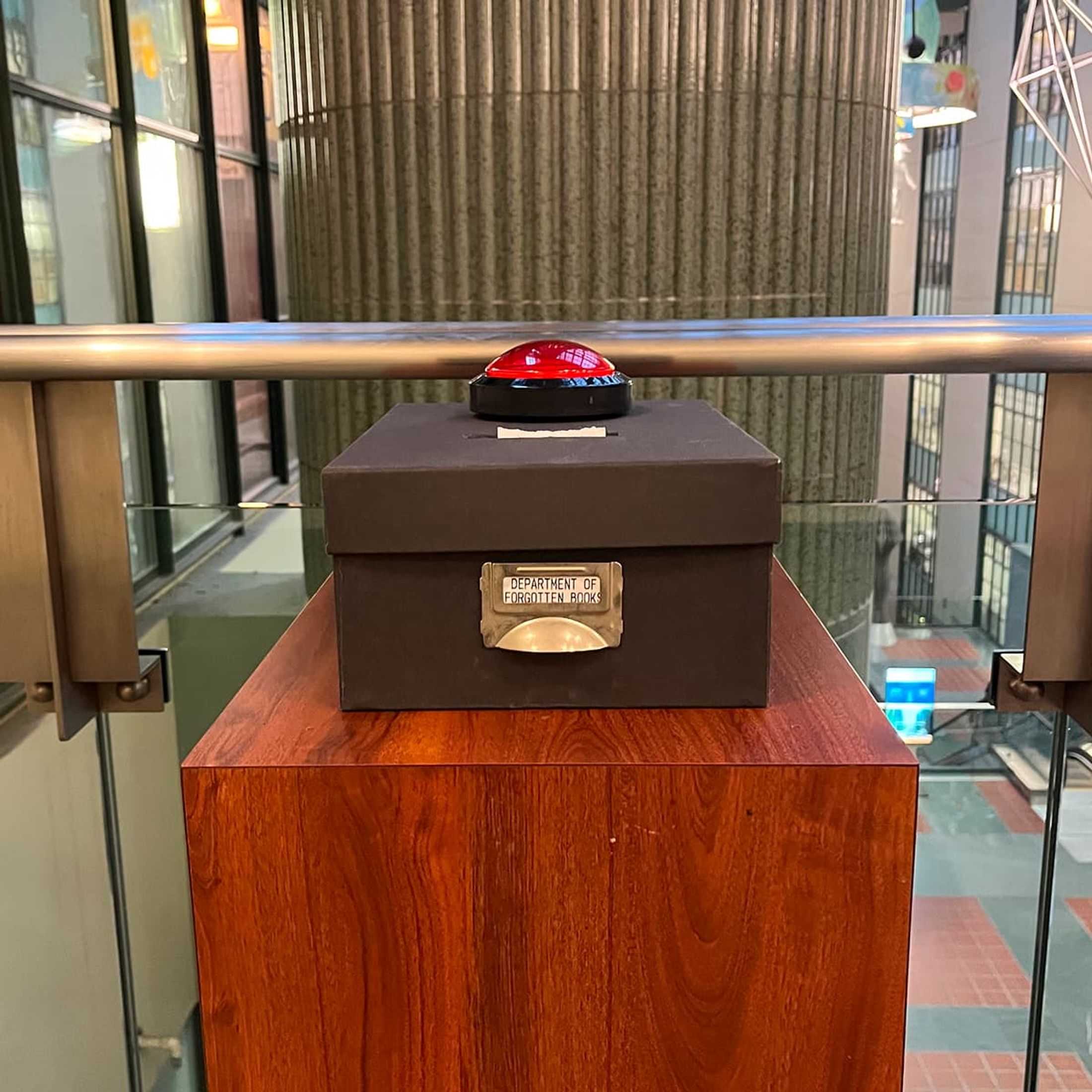 What's this in the library? A big red button. Go on, press it.