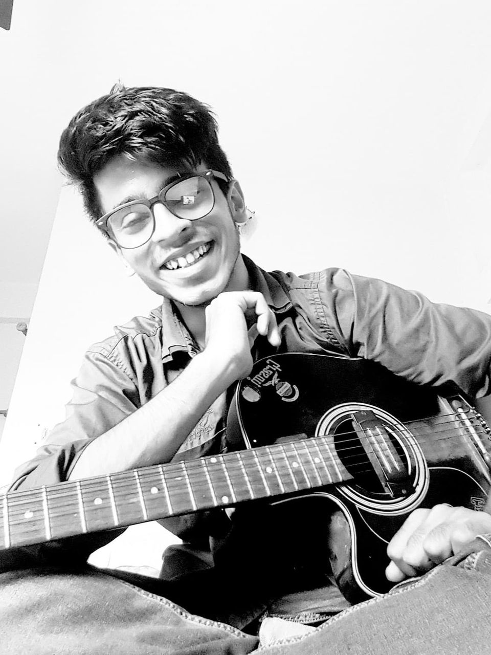 Image of Anirban Das with a guitar.
