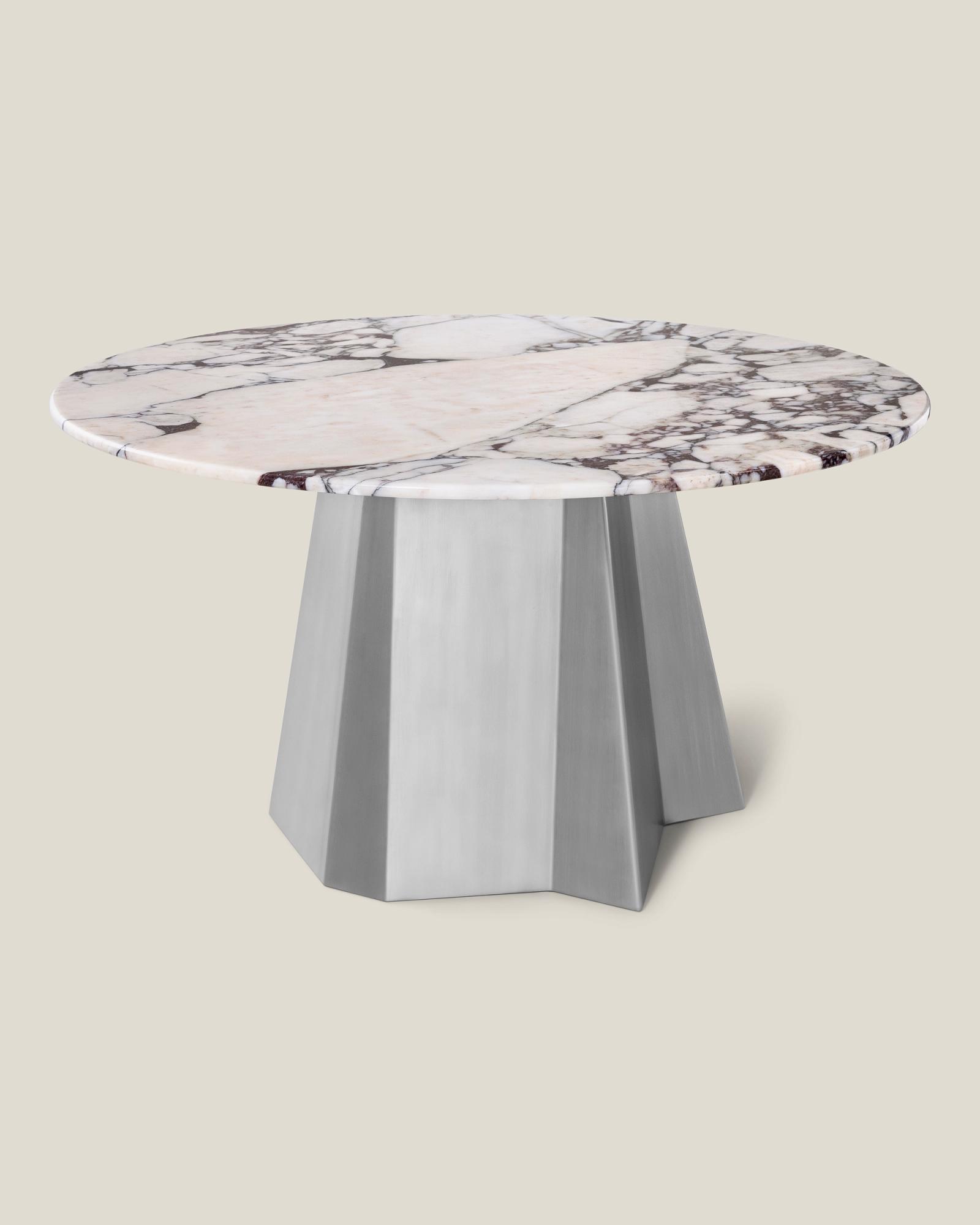 Dining table with stainless steel base and marble top