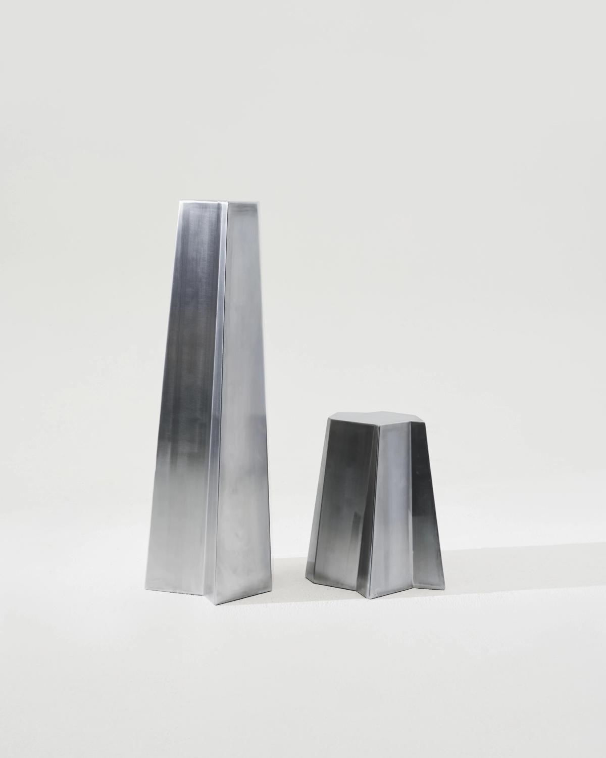 Sculptural pedestal in stainless steel