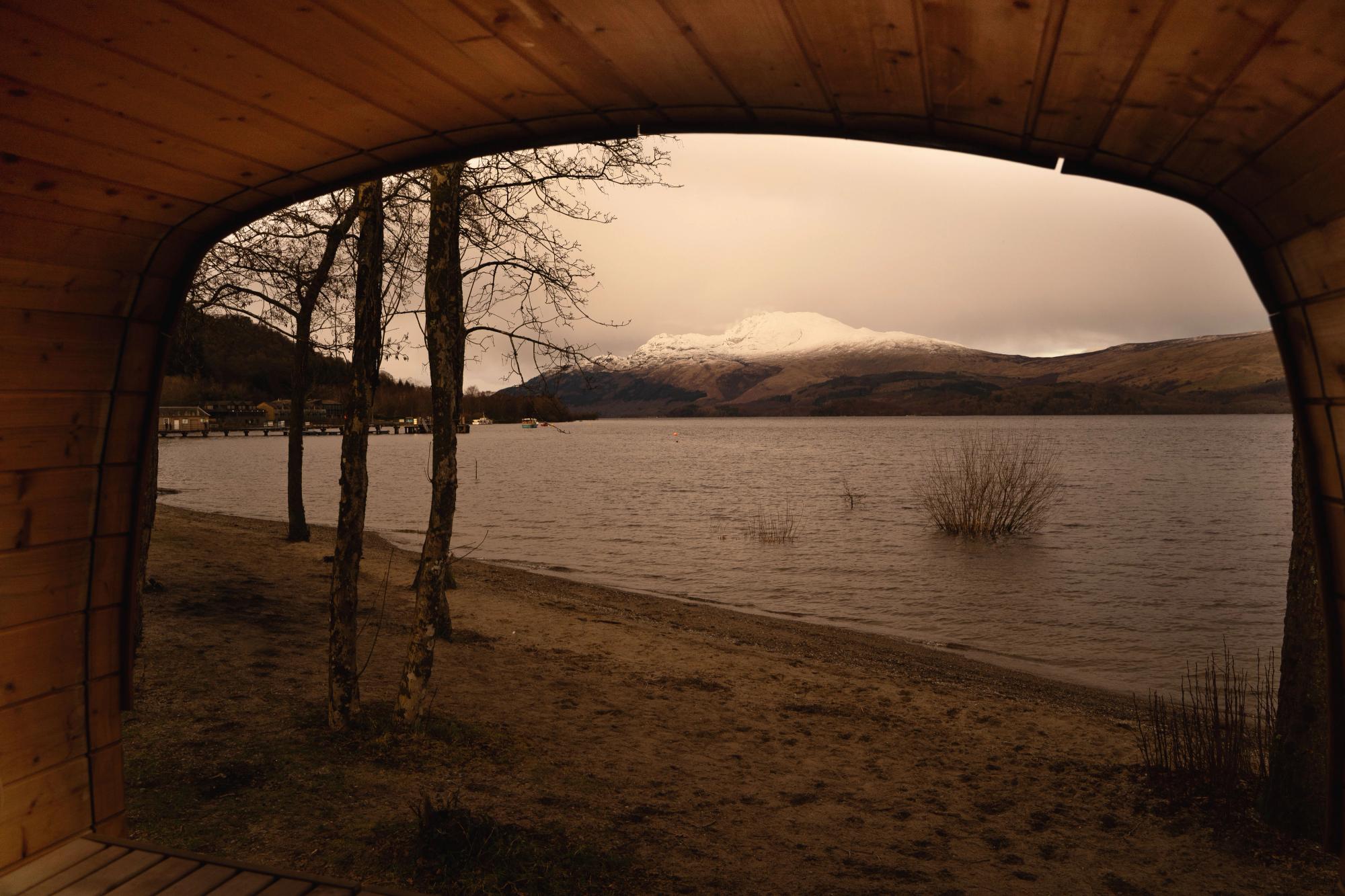 Ben Lomond covered in snow, as seen from inside the sauna