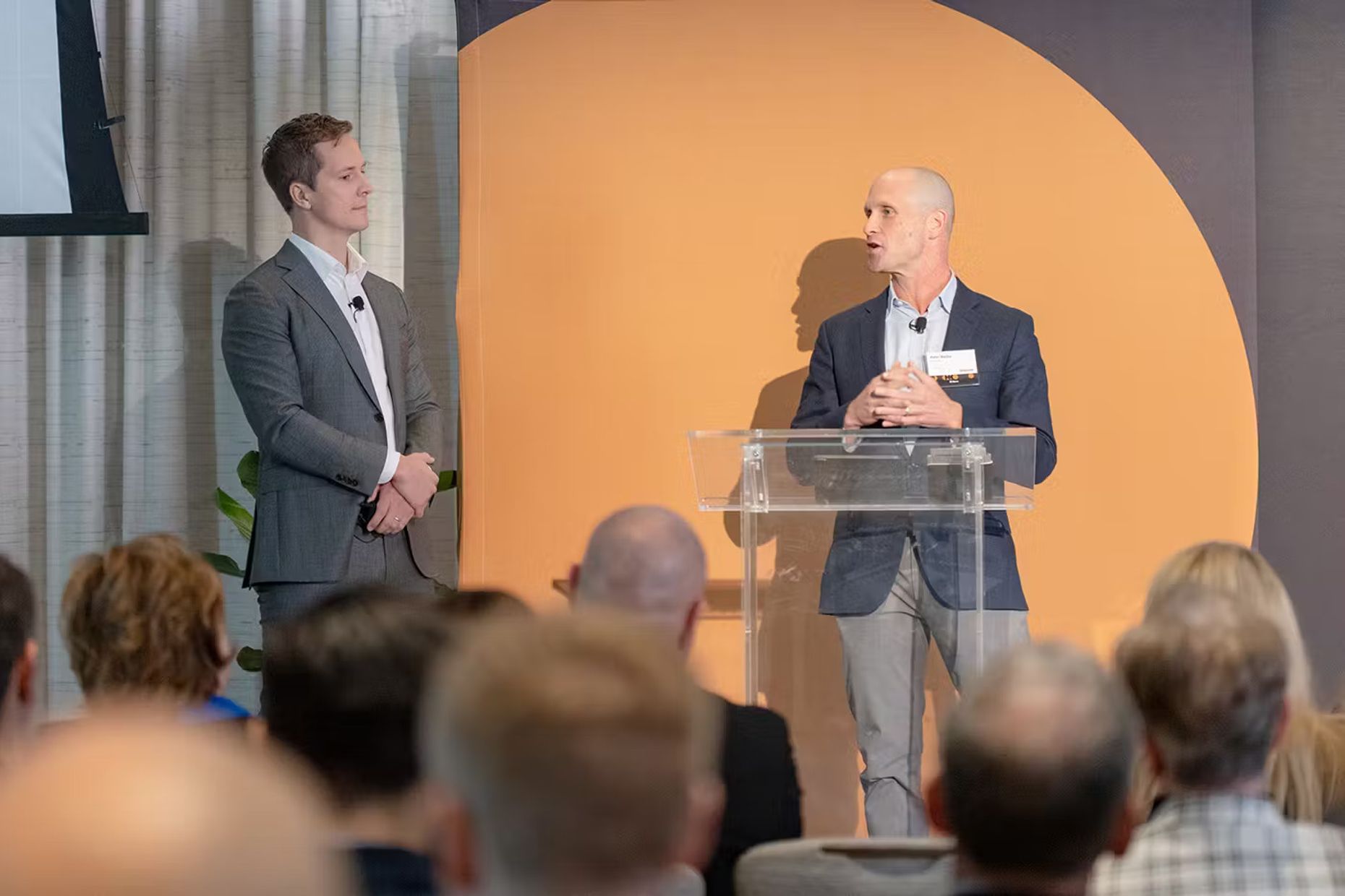 Two speakers on stage at the Altana summit