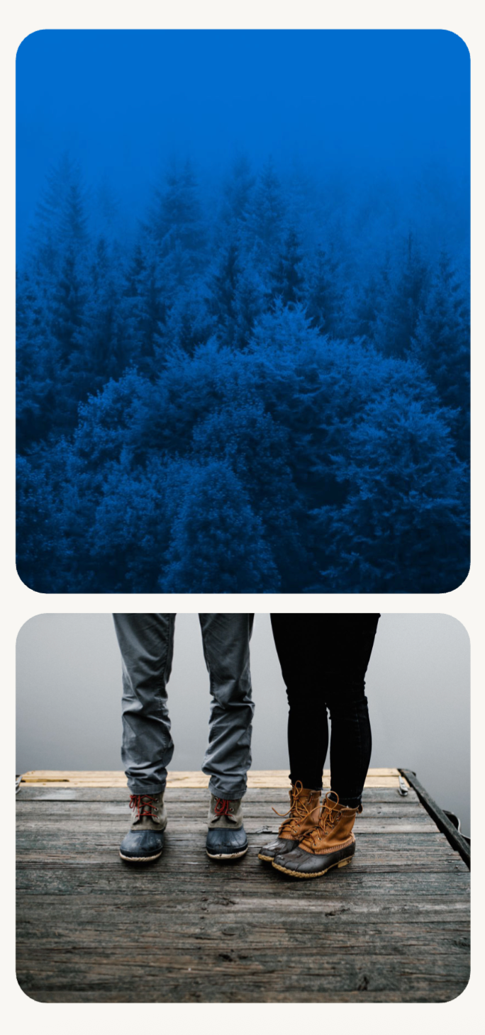 Blue-toned forest landscape paired with hiking boots on a wooden deck