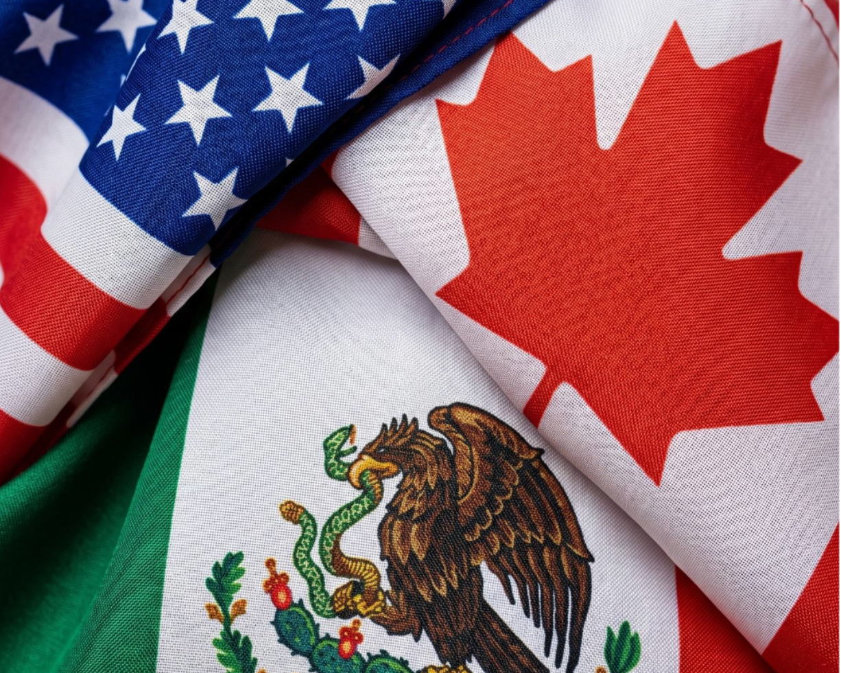 US, Canada, Mexico flags layered togethe