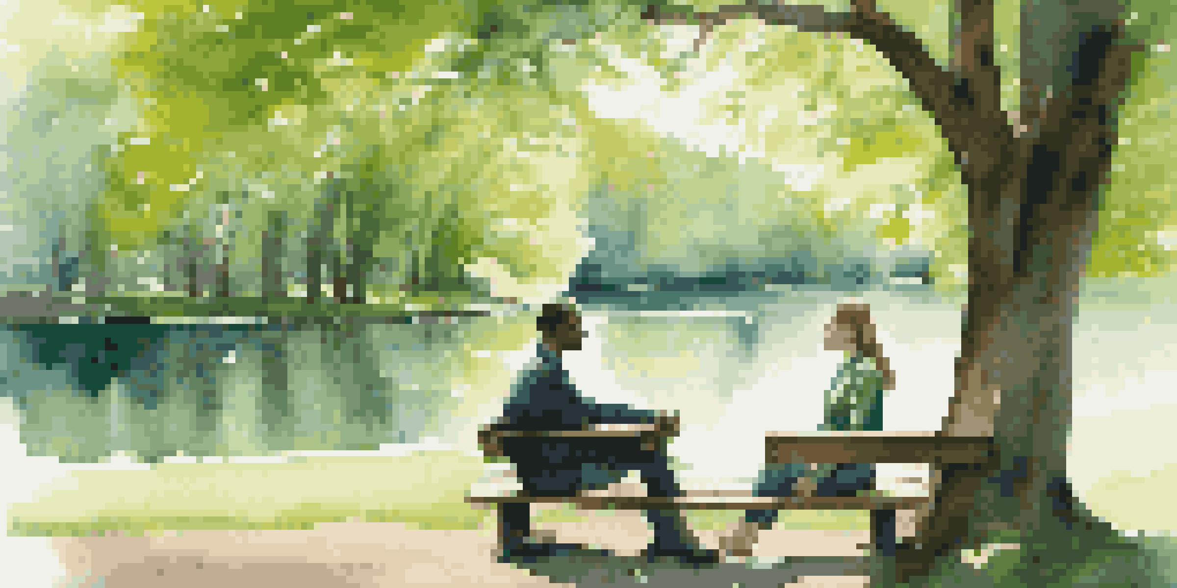 Two people sitting on a bench in a park, engaged in a conversation with a peaceful lake and trees in the background.
