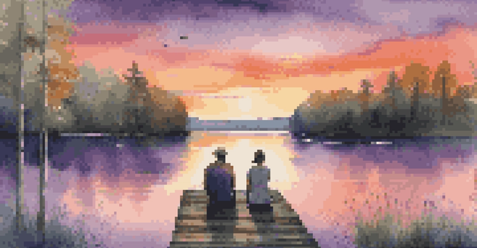 A couple sitting on a wooden dock by a calm lake at sunset, surrounded by greenery.