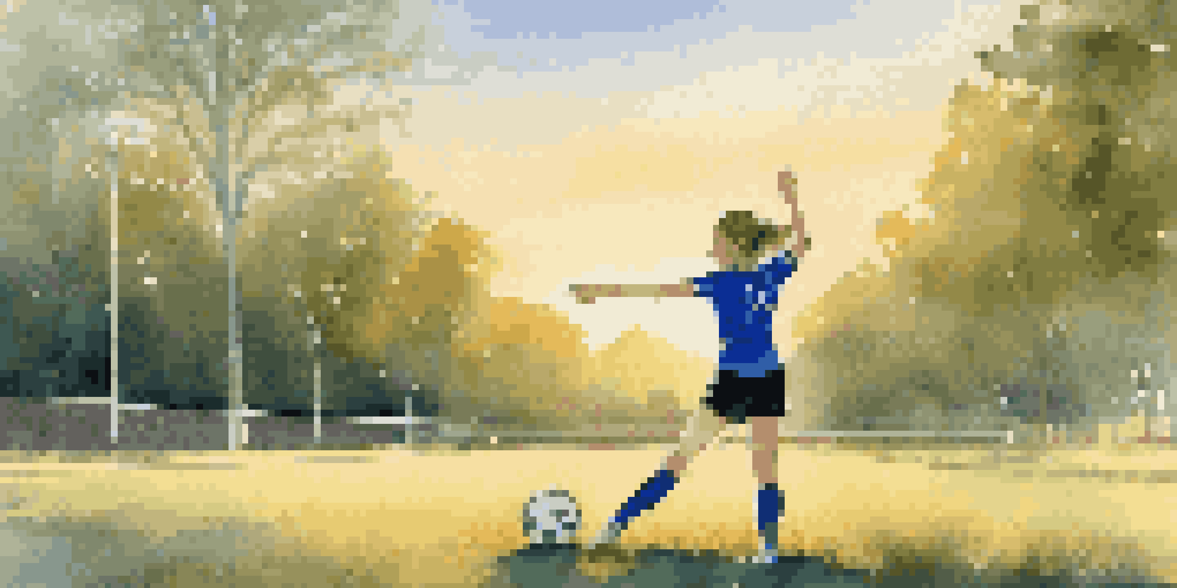 A teenage girl in a blue sports jersey stretches on a grassy field at sunset before soccer practice.