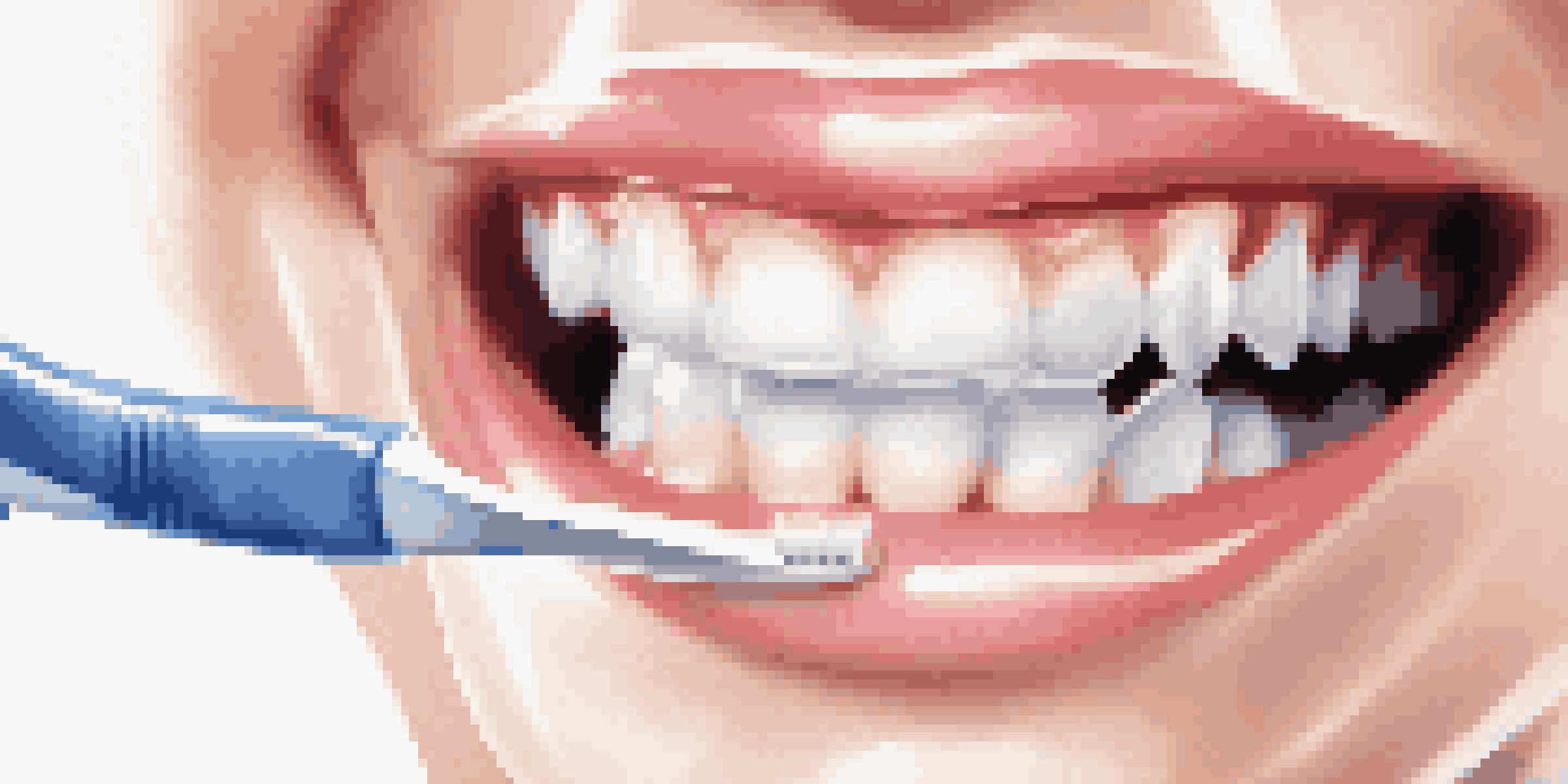 A close-up of a healthy mouth with bright white teeth and healthy gums, featuring a toothbrush and dental floss in the foreground.