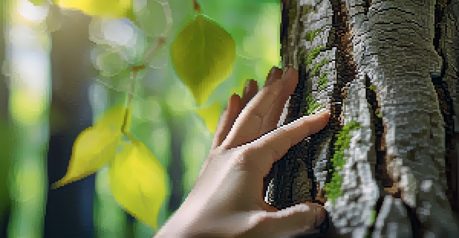 A close-up of a hand resting on tree bark, with green leaves blurred in the background, emphasizing the connection to nature.