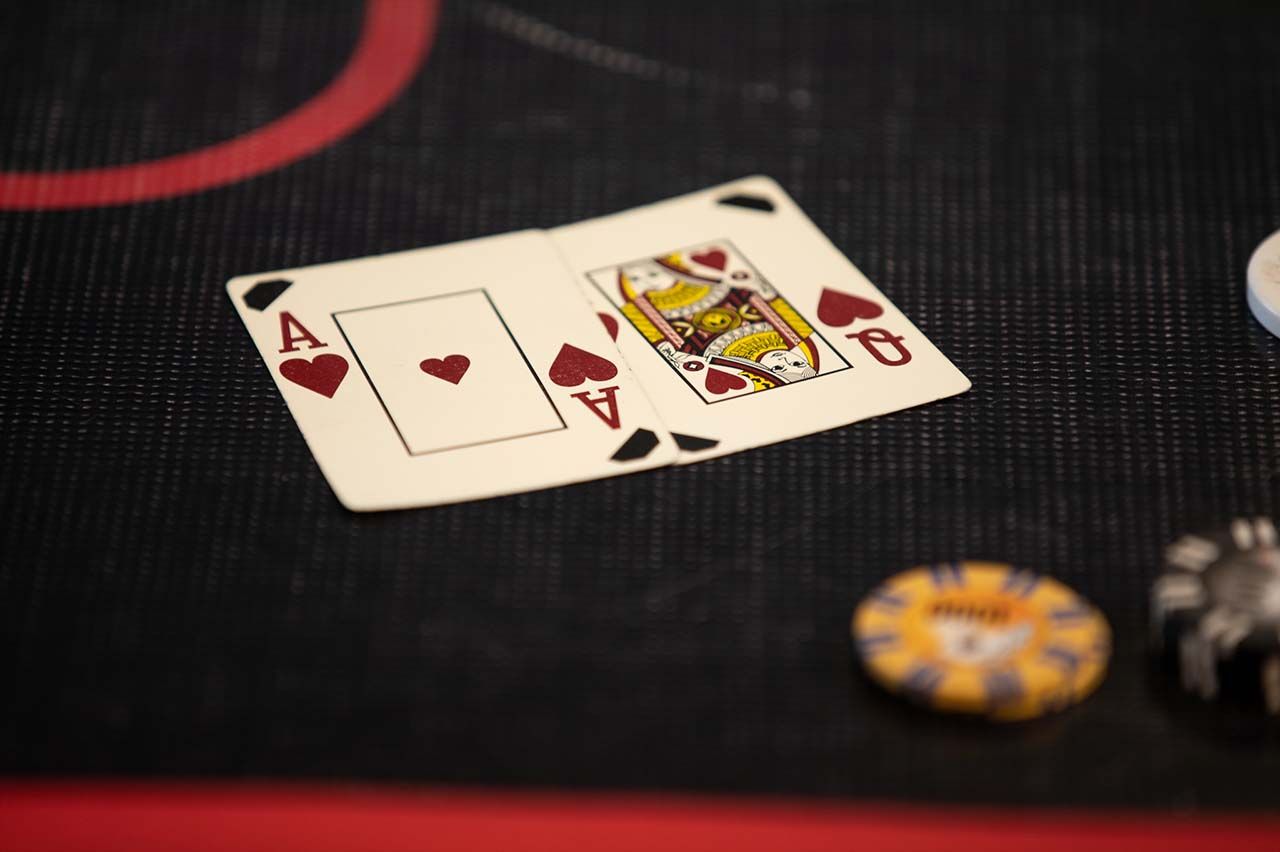 Close up of an Ace of Hearts and Queen of Hearts playing cards