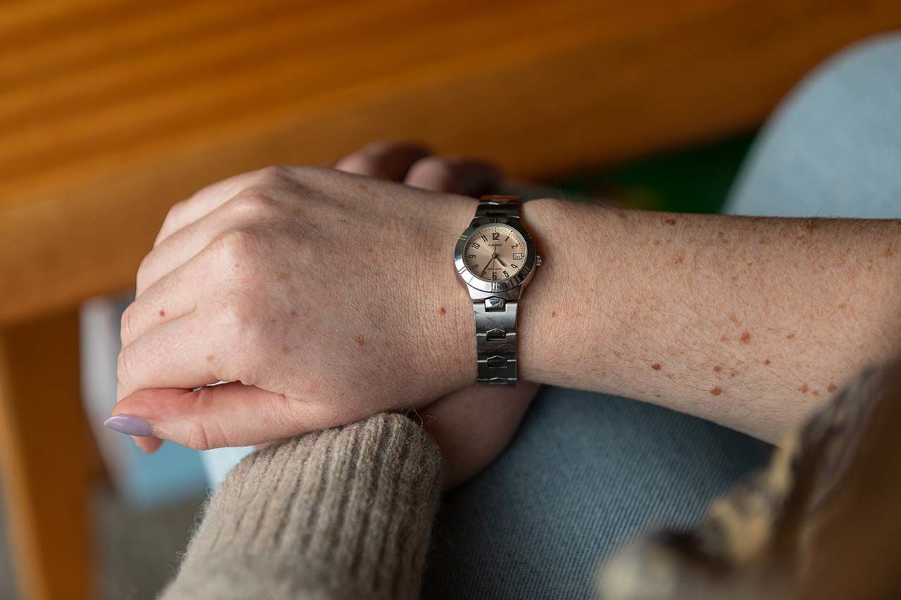 Close up of silver watch on a woman's arm