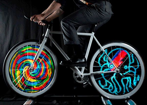 Bike on rollers with lights in wheels