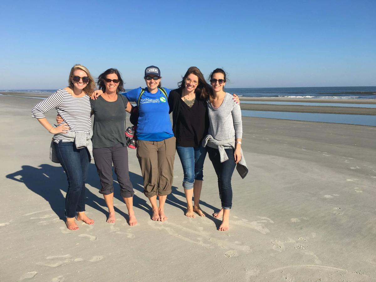 Jessica Weeman with a group of women in a beach