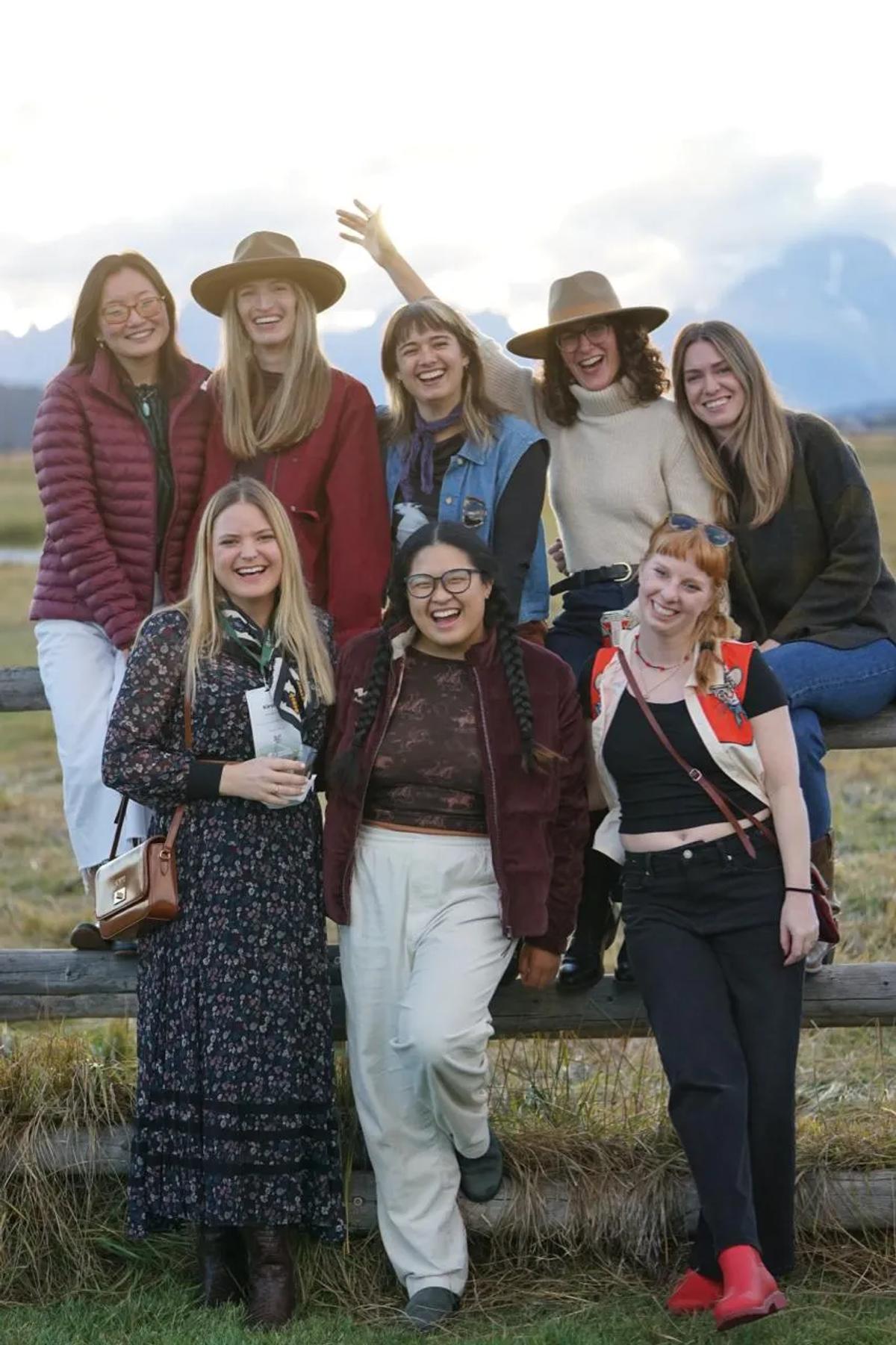Jessica Weeman with a group of women in the field.