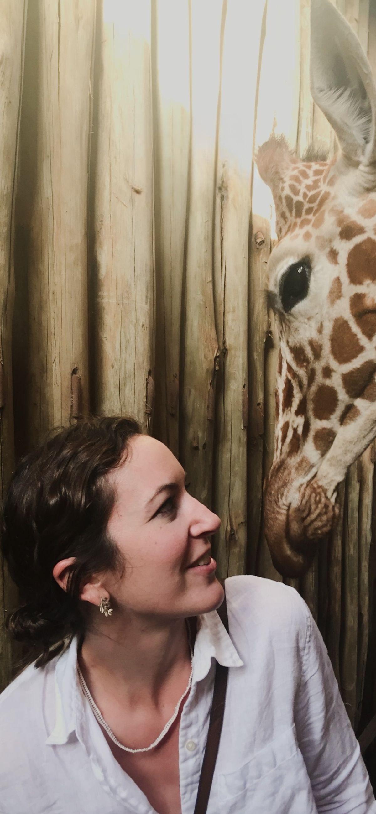 Jessica Weeman founder of Weemston Consulting next to a giraffe