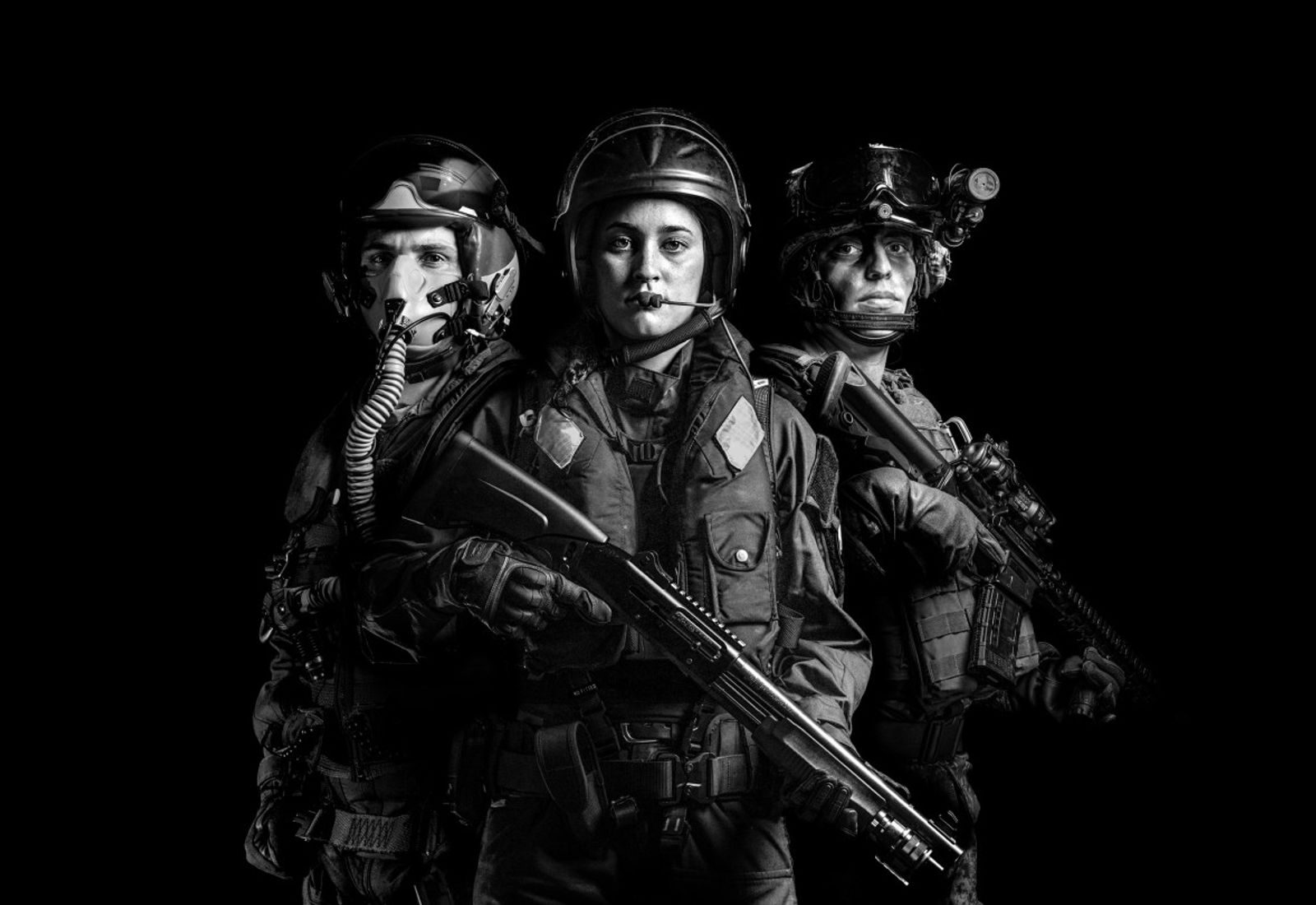 A black and white photograph depicting personnel from the New Zealand Defence Force. The image includes representatives from all three branches: the Army, Navy, and Air Force.