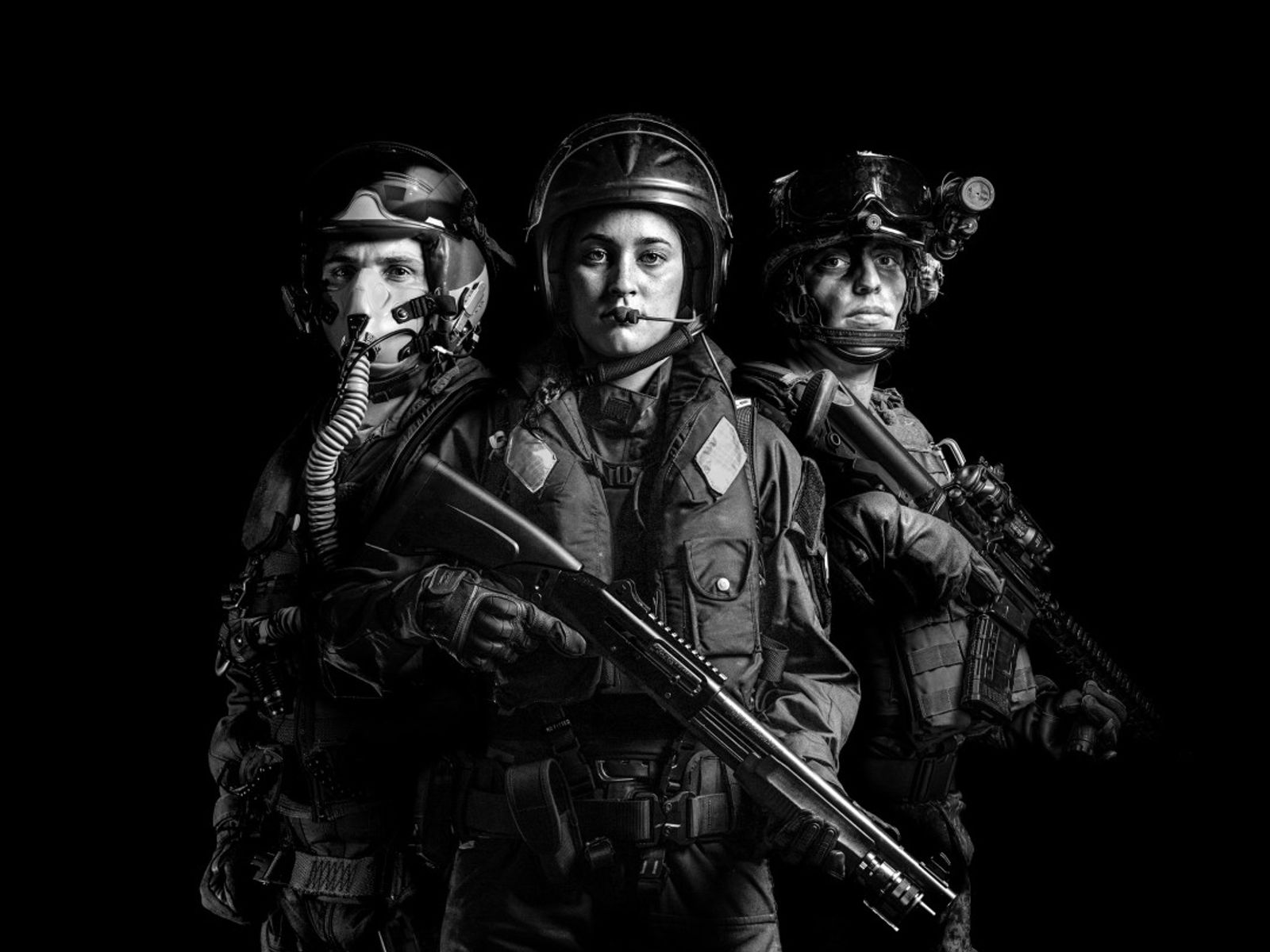 A black and white photograph depicting personnel from the New Zealand Defence Force. The image includes representatives from all three branches: the Army, Navy, and Air Force.