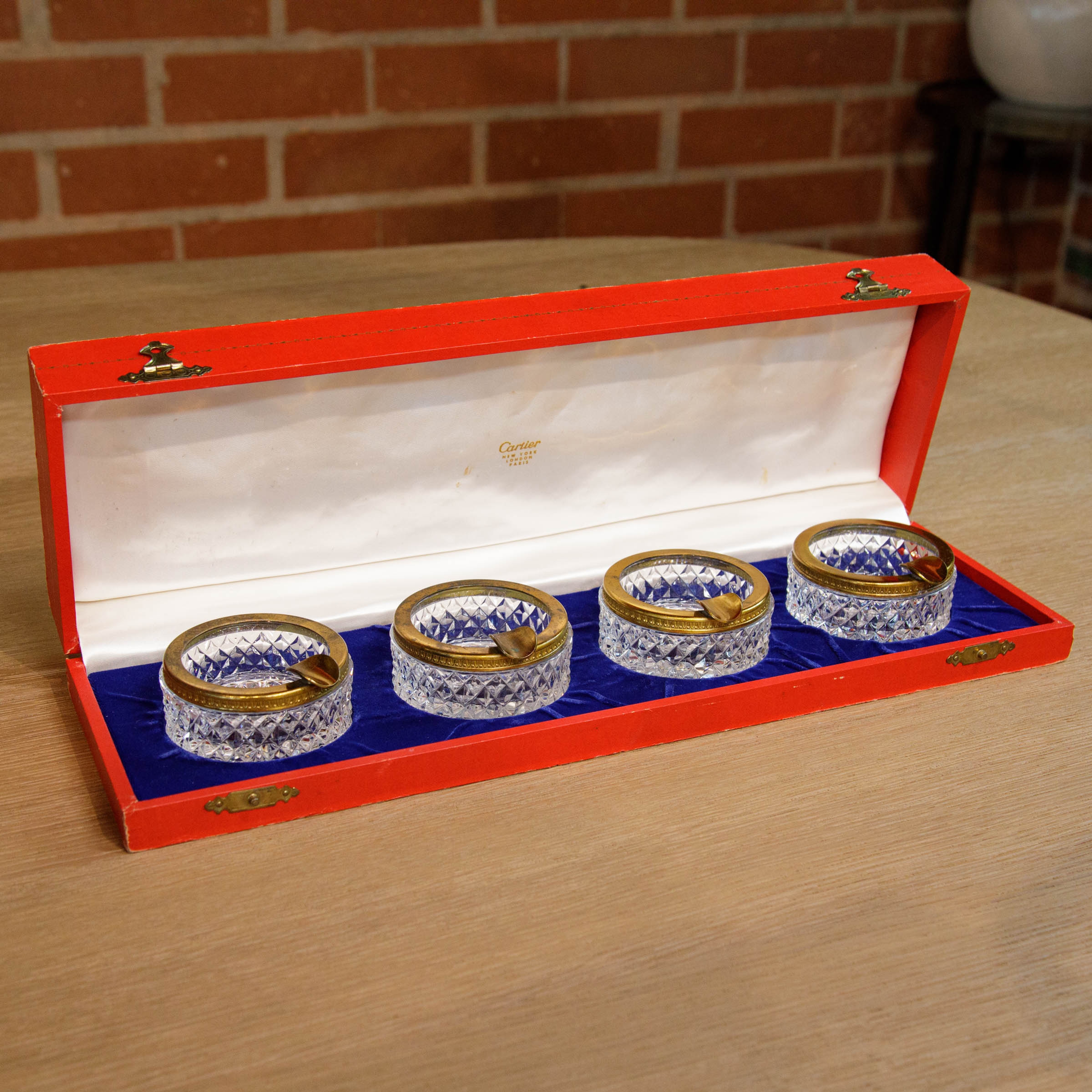 Four Brass and Crystal Ashtrays