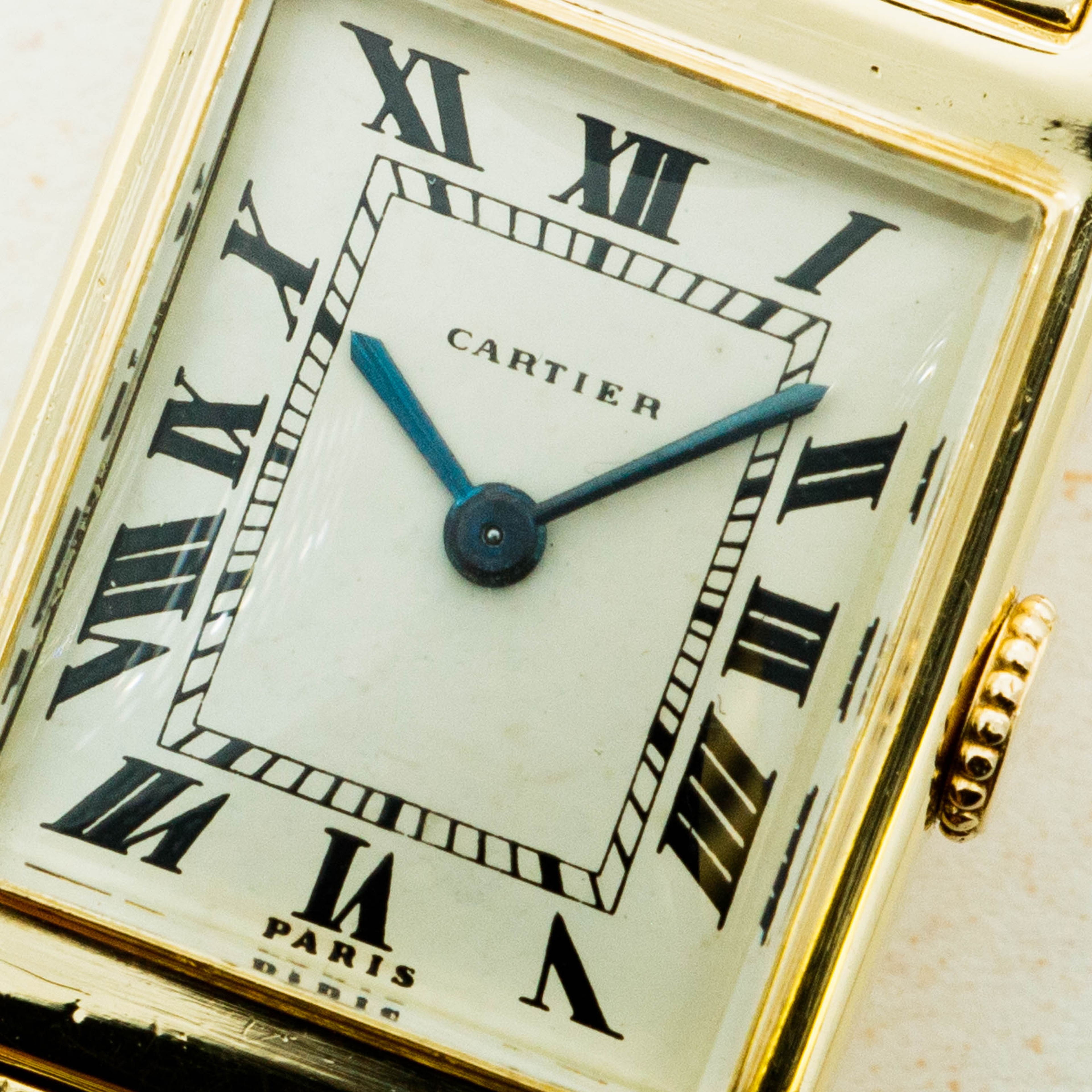 Dial Fitted with Cartier's signature white dial with black Roman numerals with blued steel hands, this Bec d' Aigle's subtle secret is its Paris inscription at 6 o'clock signifying this beautiful example's collectible status.