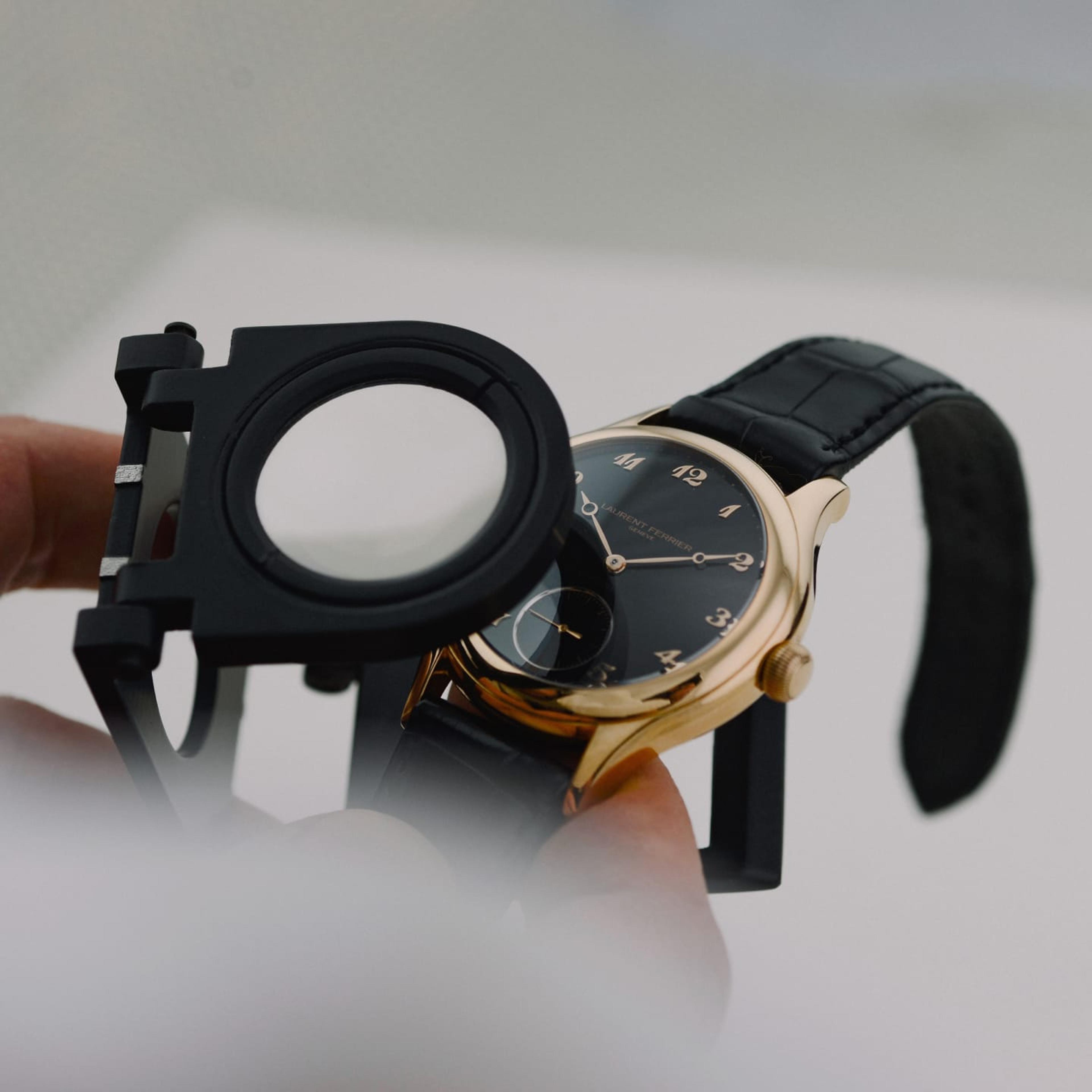A watch viewed through a loupe