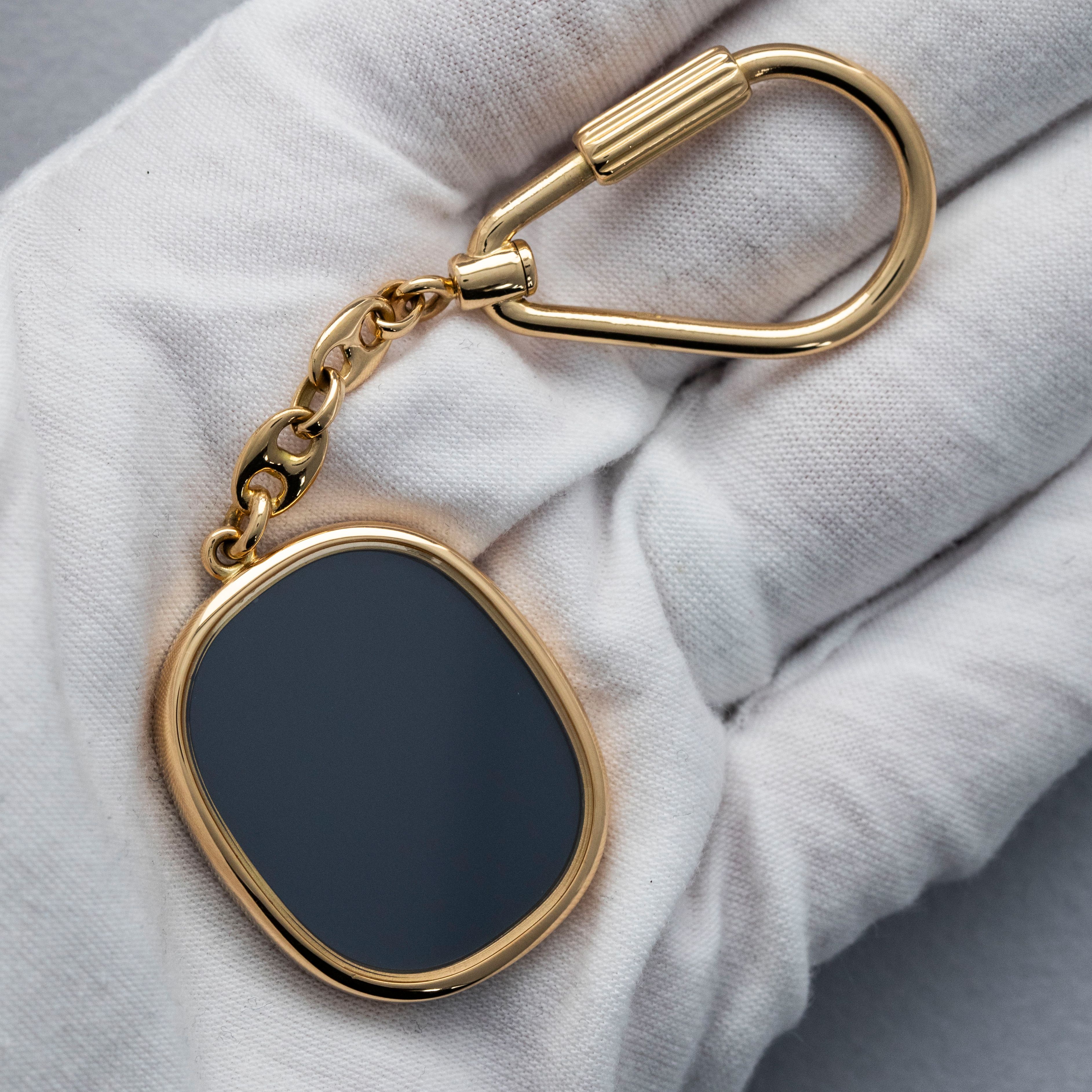 Patek Philippe Ellipse Keychain 9602J 18K YG | Auctions | Loupe This