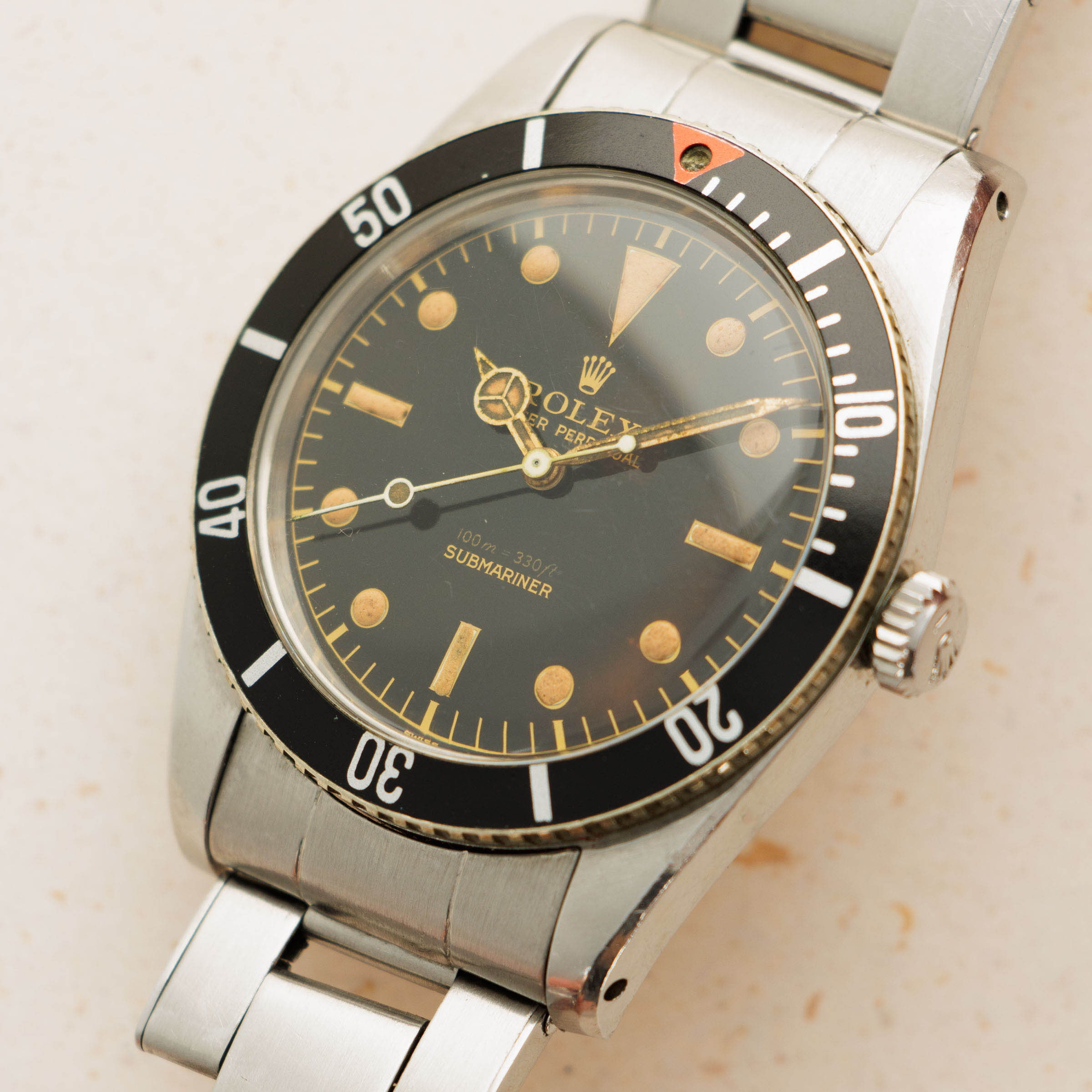 Rolex submariner red triangle hot sale