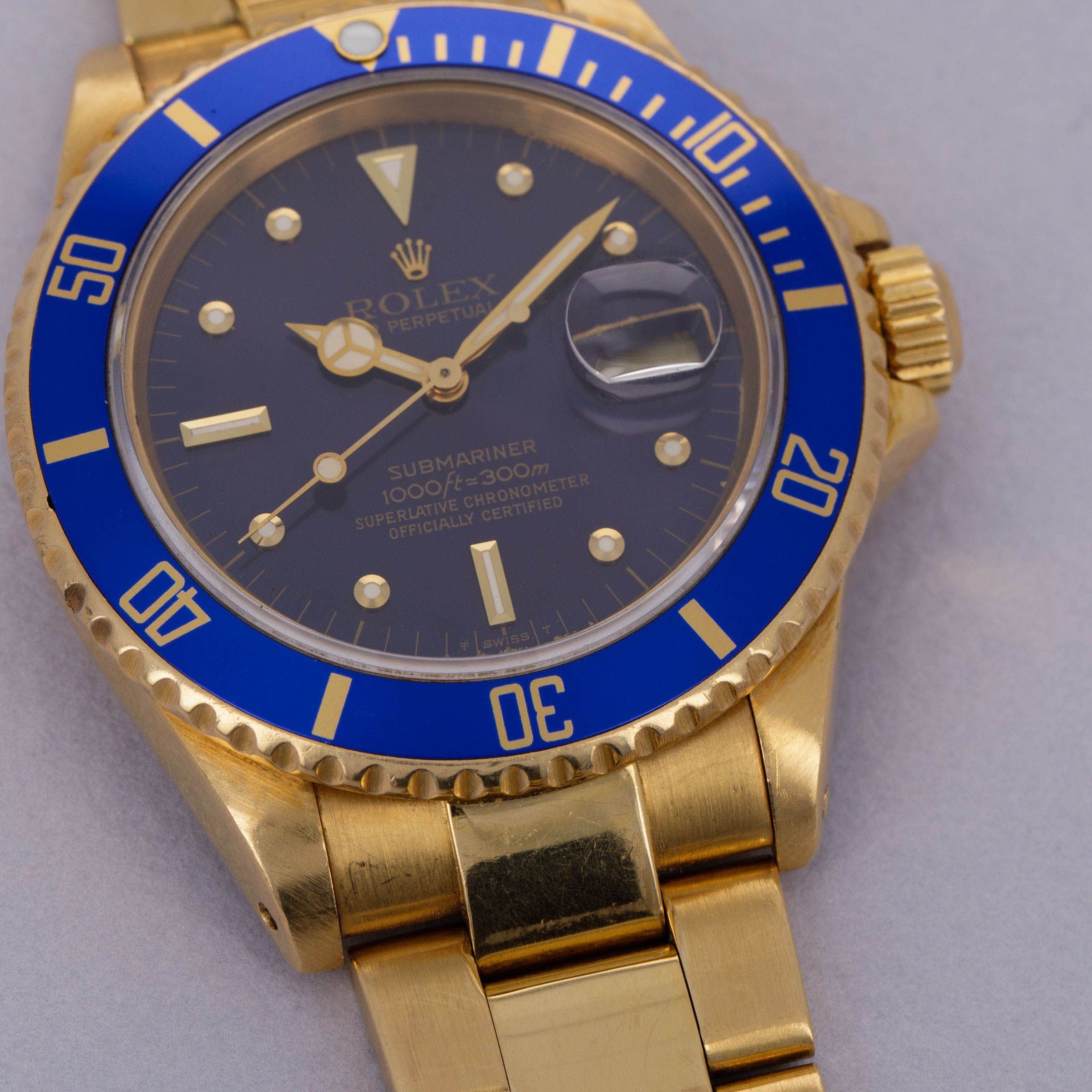 Rolex Submariner 16808 Blue Nipple Dial 18k YG | Auctions | Loupe This