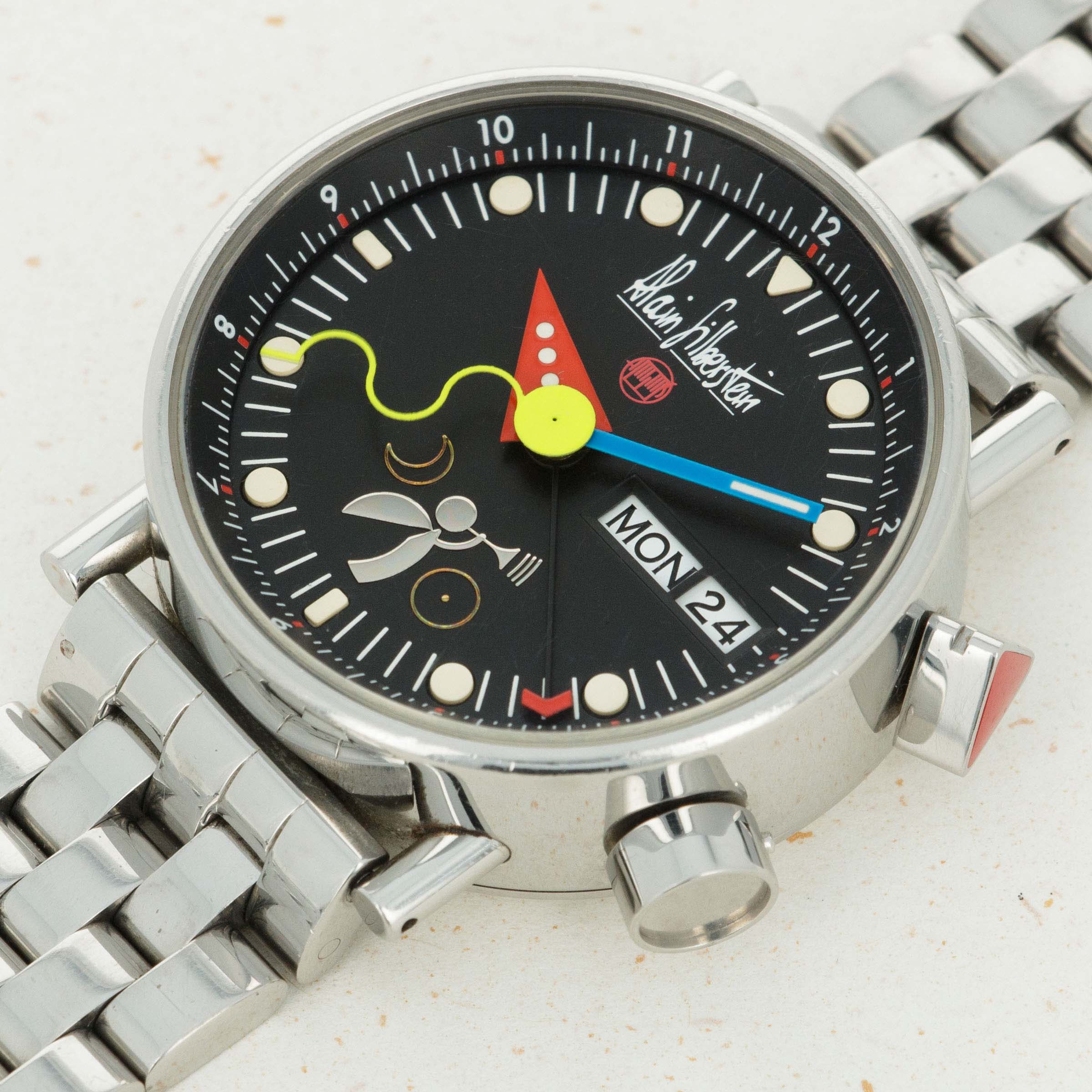Featuring Alain Silberstein's quirky design language, the Le Reveil Noir sports a colorful collection of interestingly shaped hands atop its matte black dial.