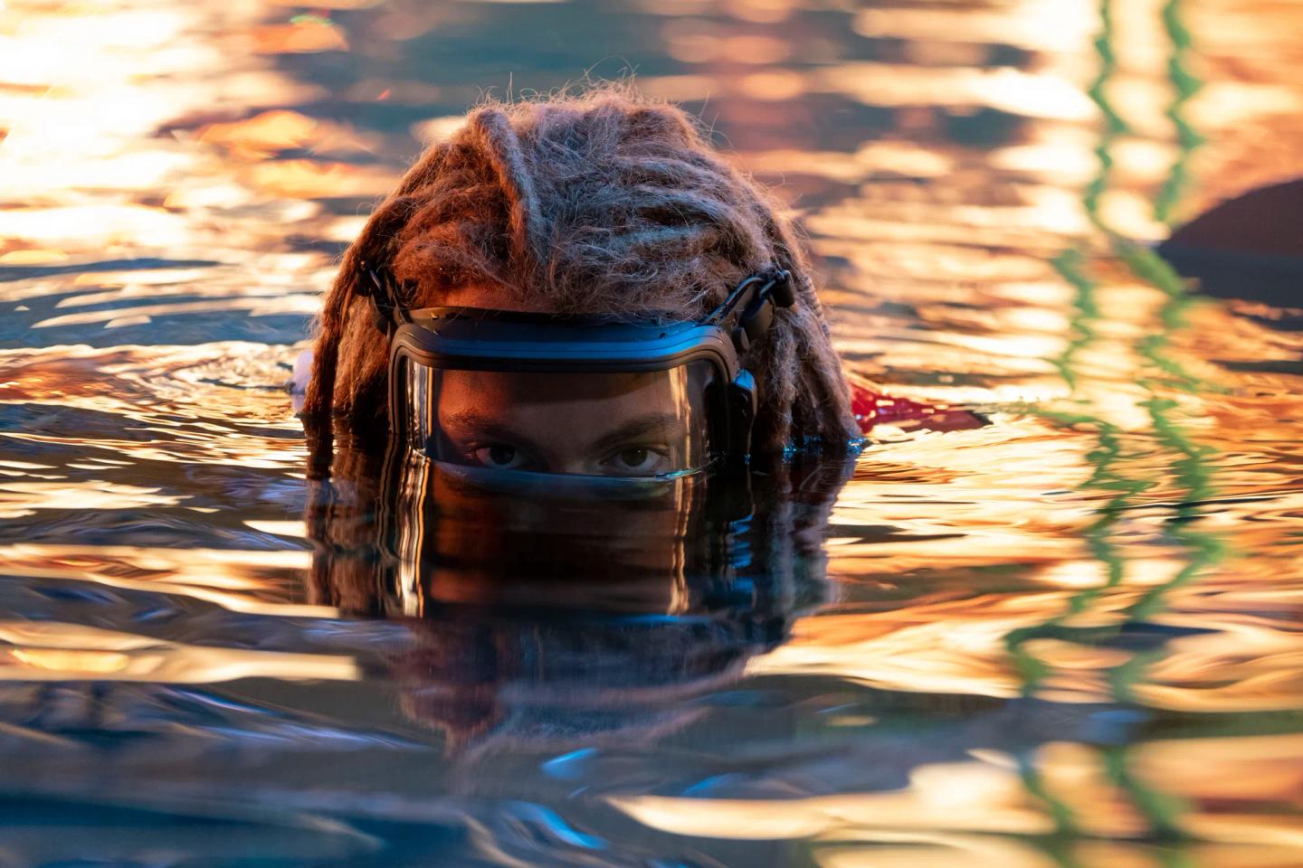a person in a mask in water