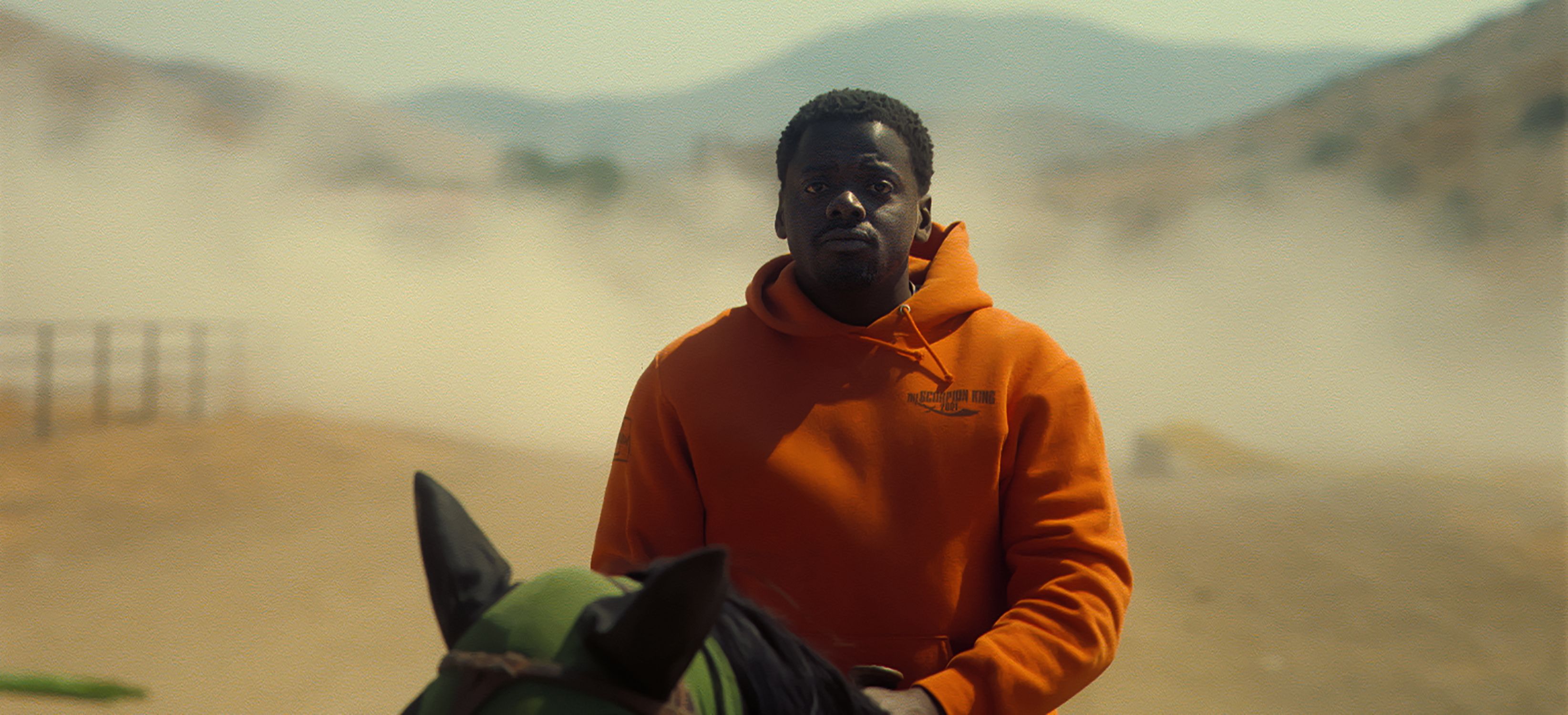 a man in an orange jacket