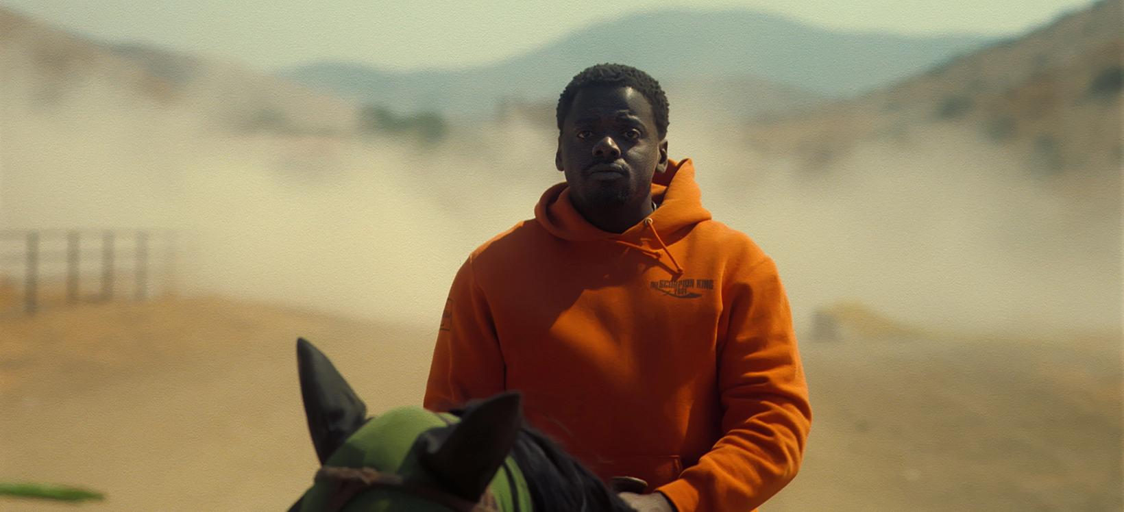 a man in an orange jacket