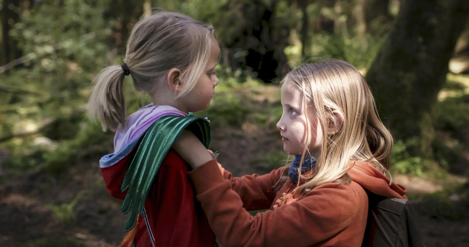 a person holding a child