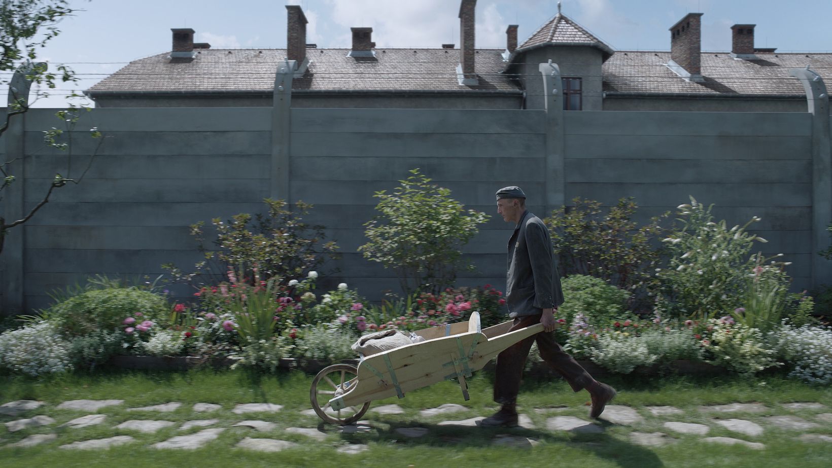 a man walking with a cart