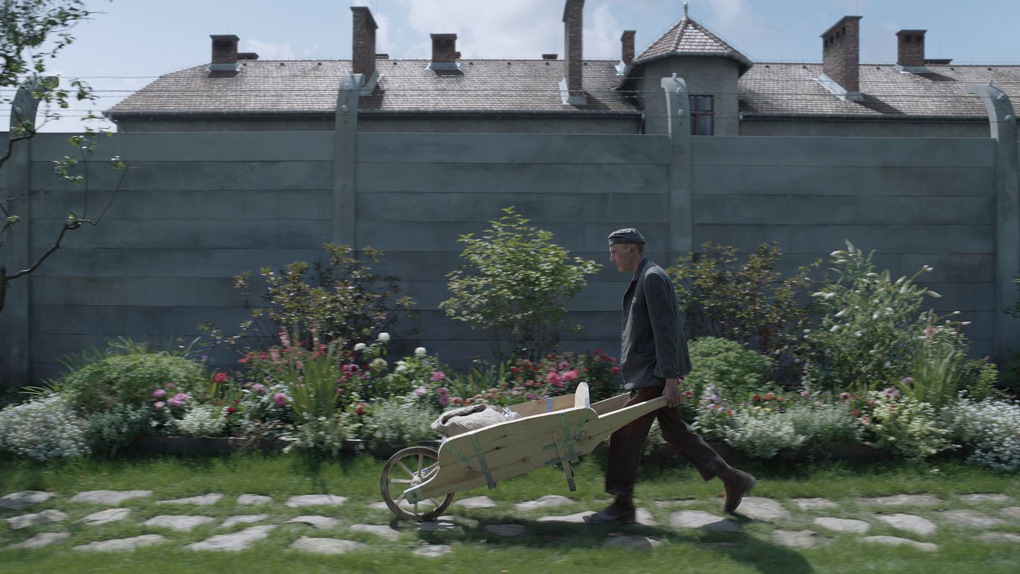 a man walking with a cart