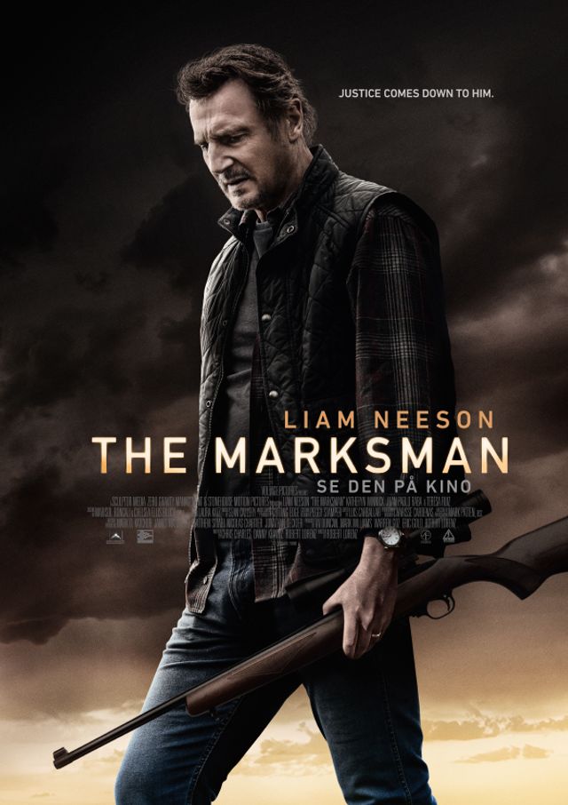 Liam Neeson holding a rifle