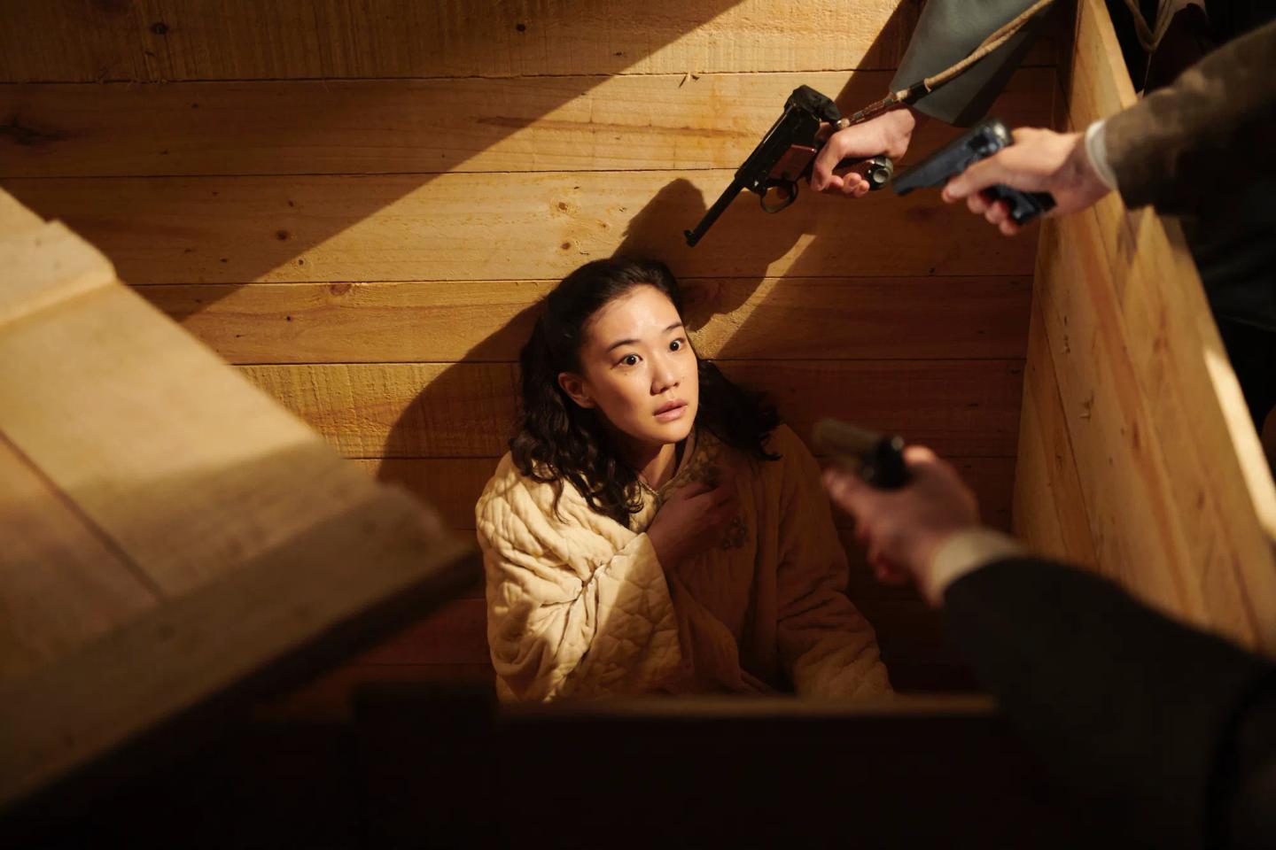Yu Aoi holding a gun