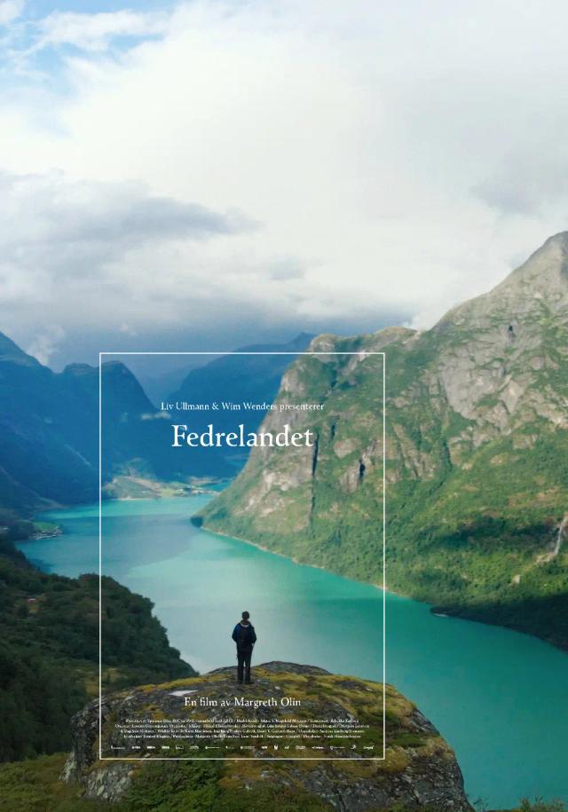 a person standing on a rock overlooking a lake and mountains