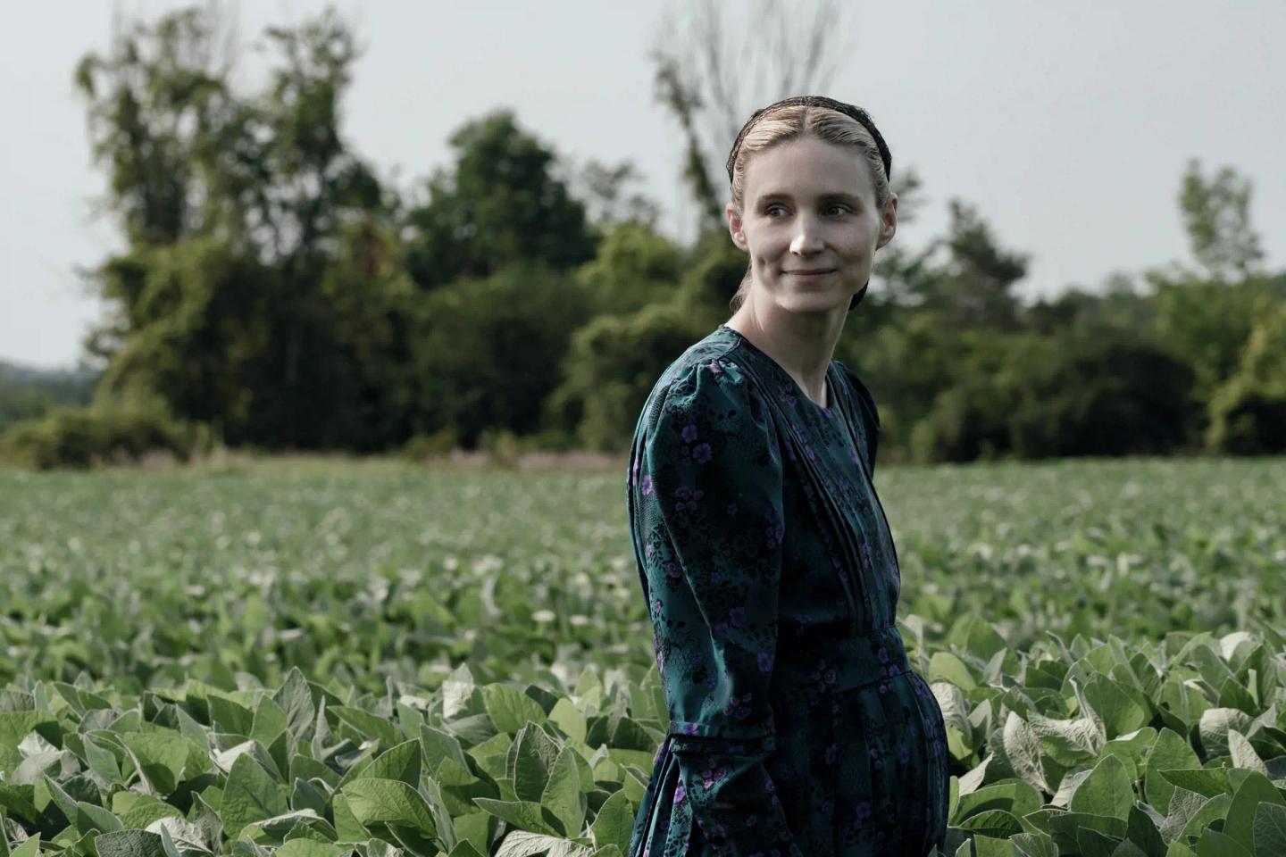 Rooney Mara standing in a field of flowers