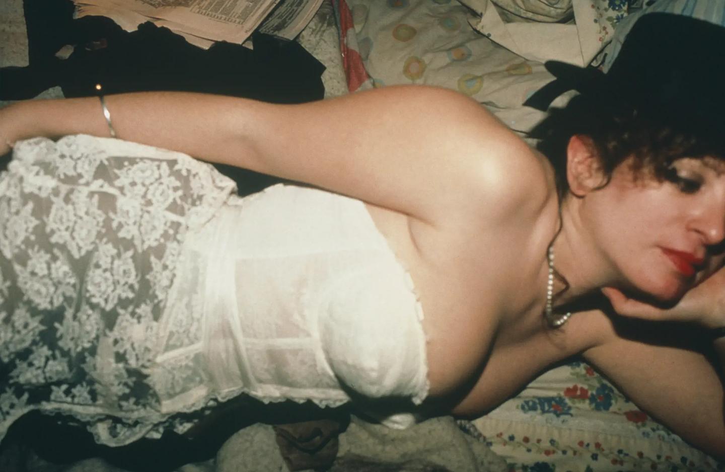 a person lying on a bed