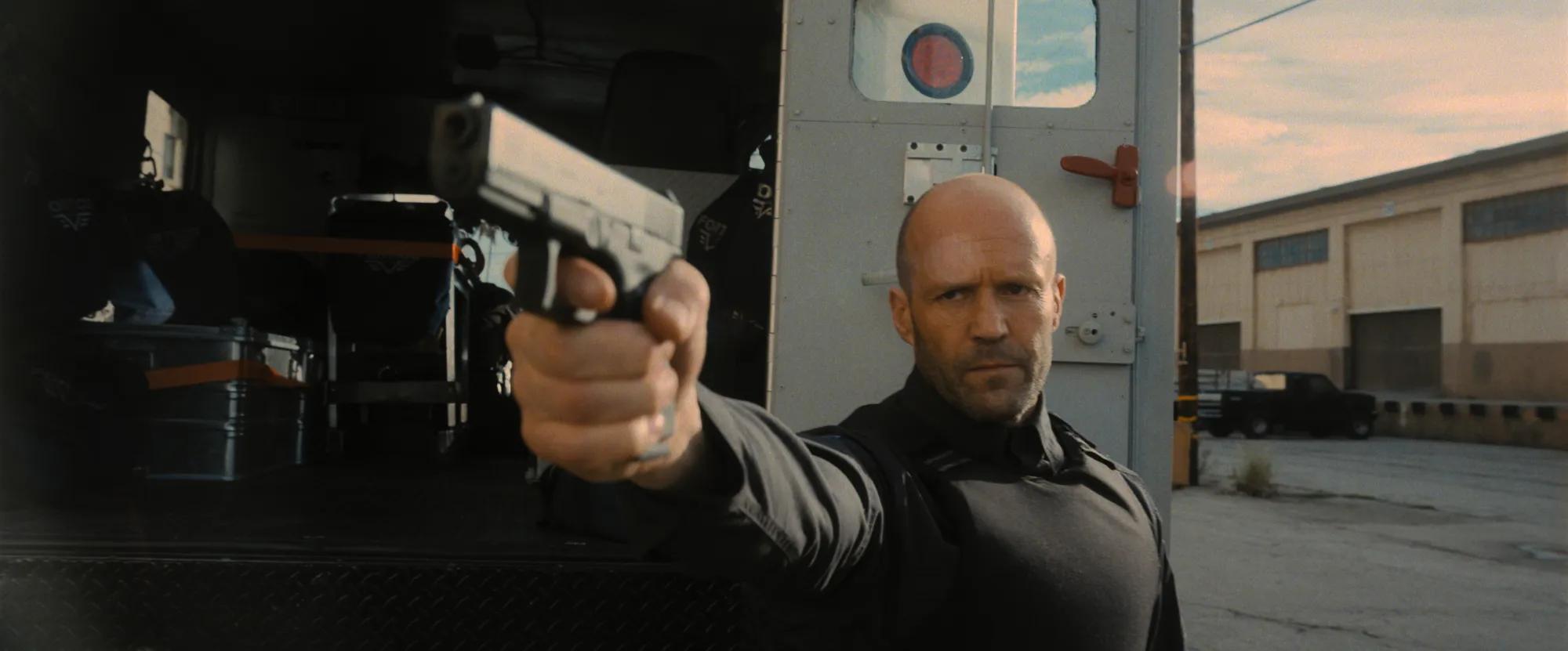 Jason Statham holding a gun