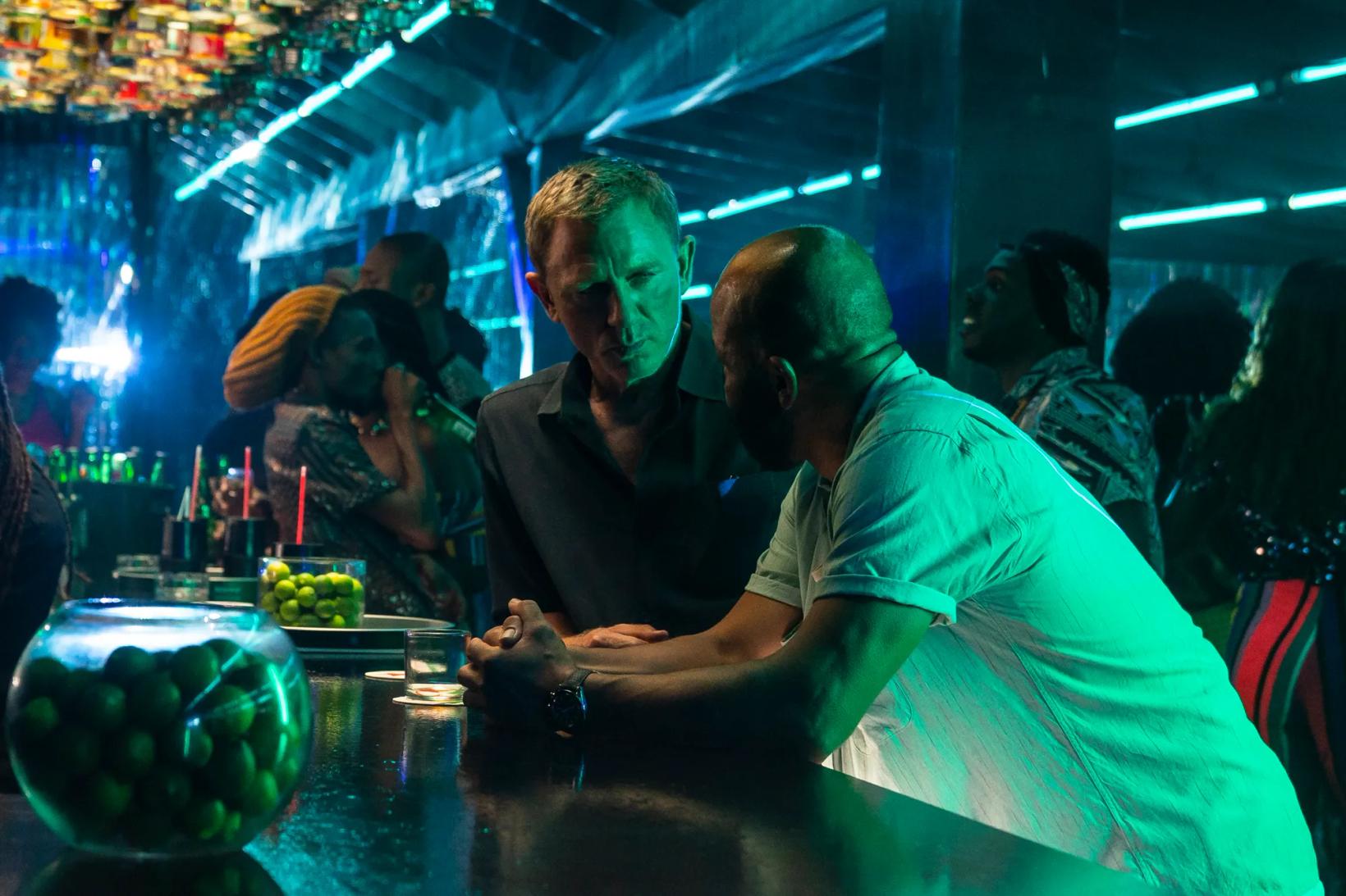 a group of people sitting at a bar