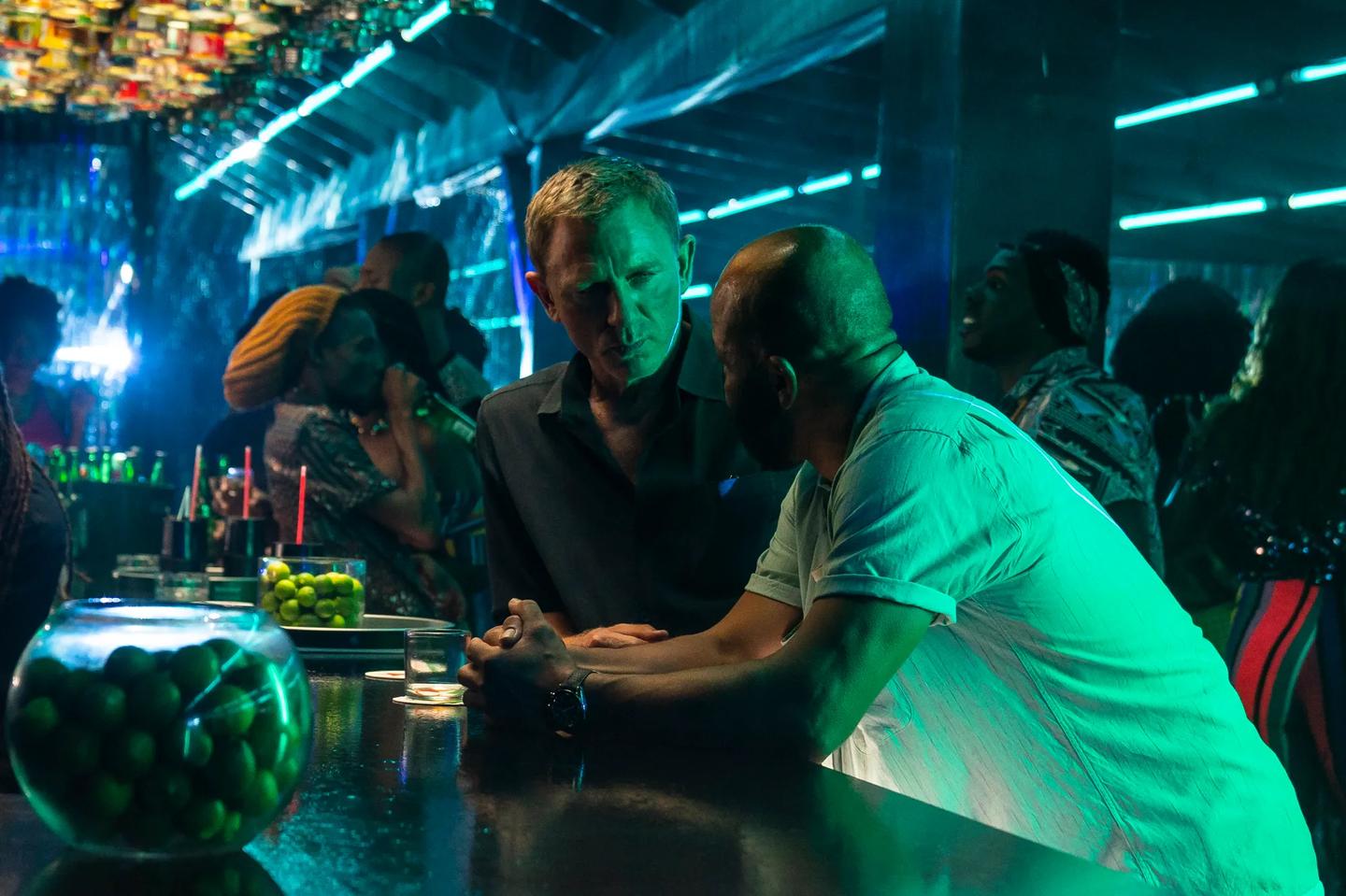 a group of people sitting at a bar