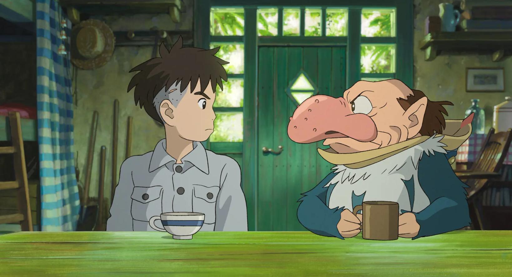 a couple of people sitting at a table with a cartoon