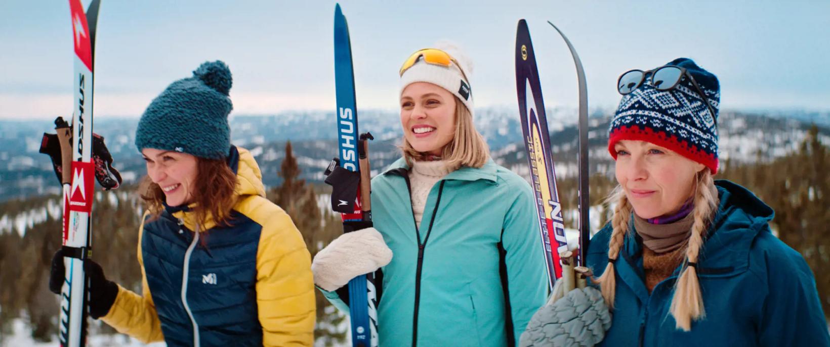 a group of people holding skis