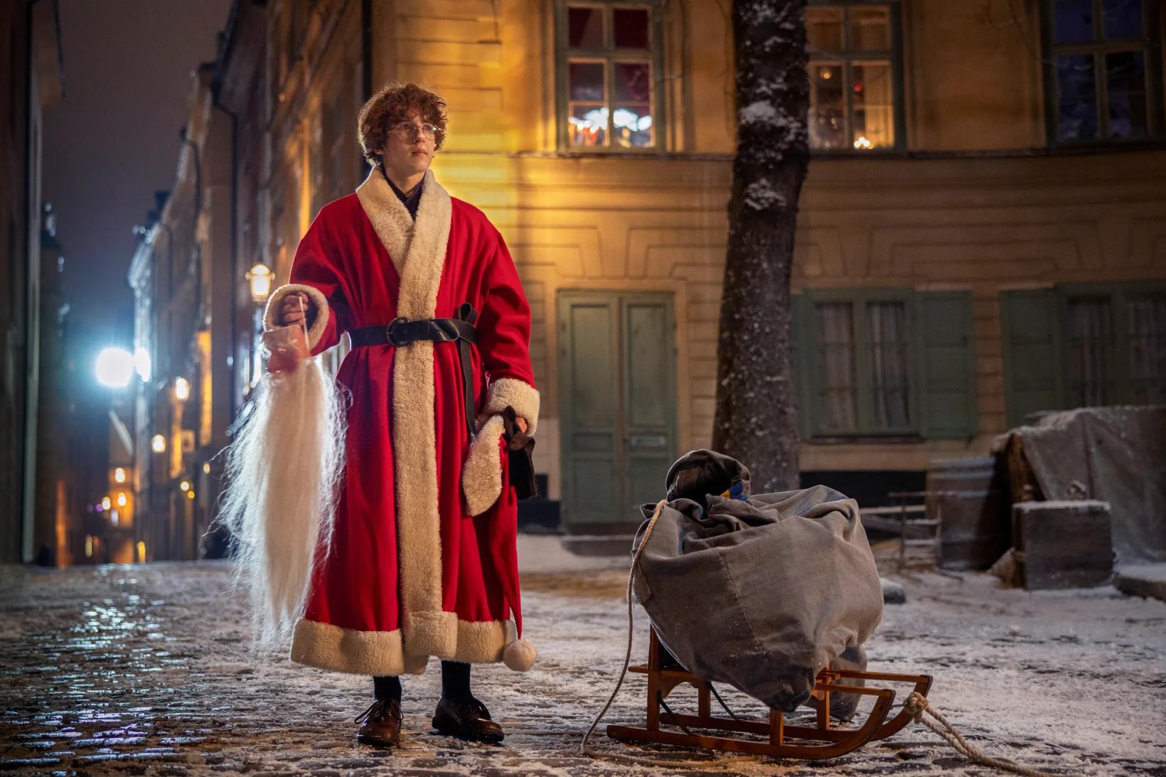 a man in a red robe and a man in a red robe