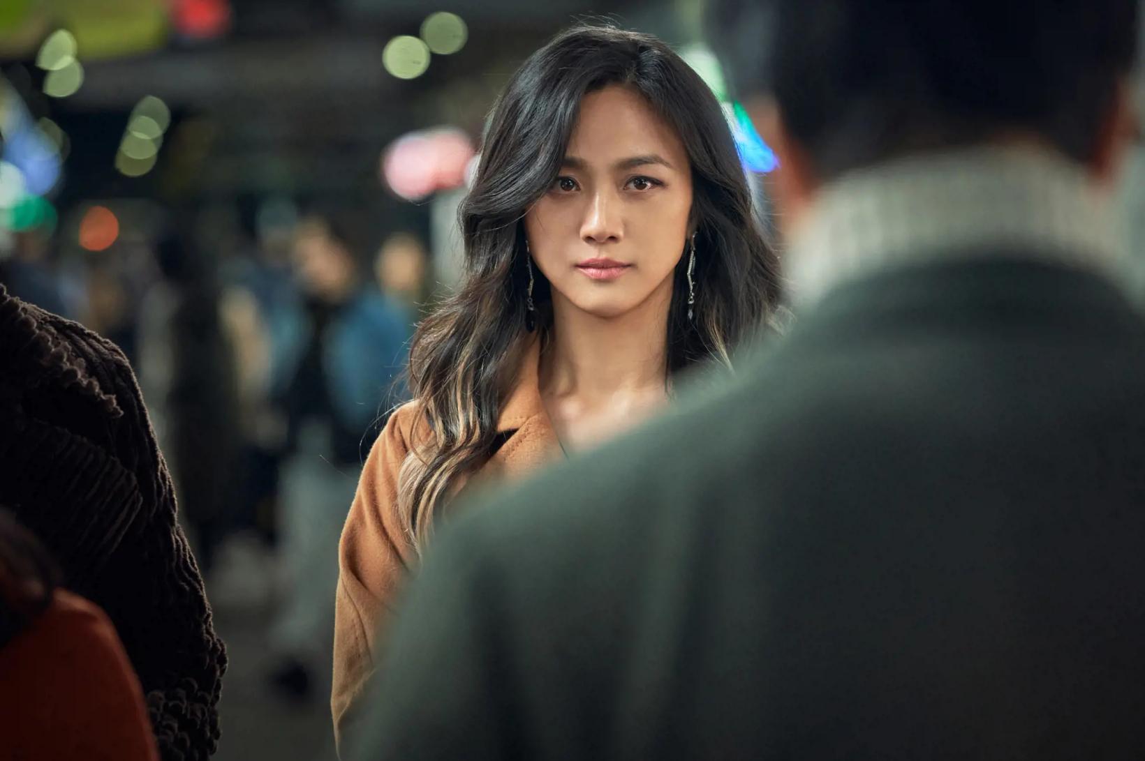 Tang Wei looking at something