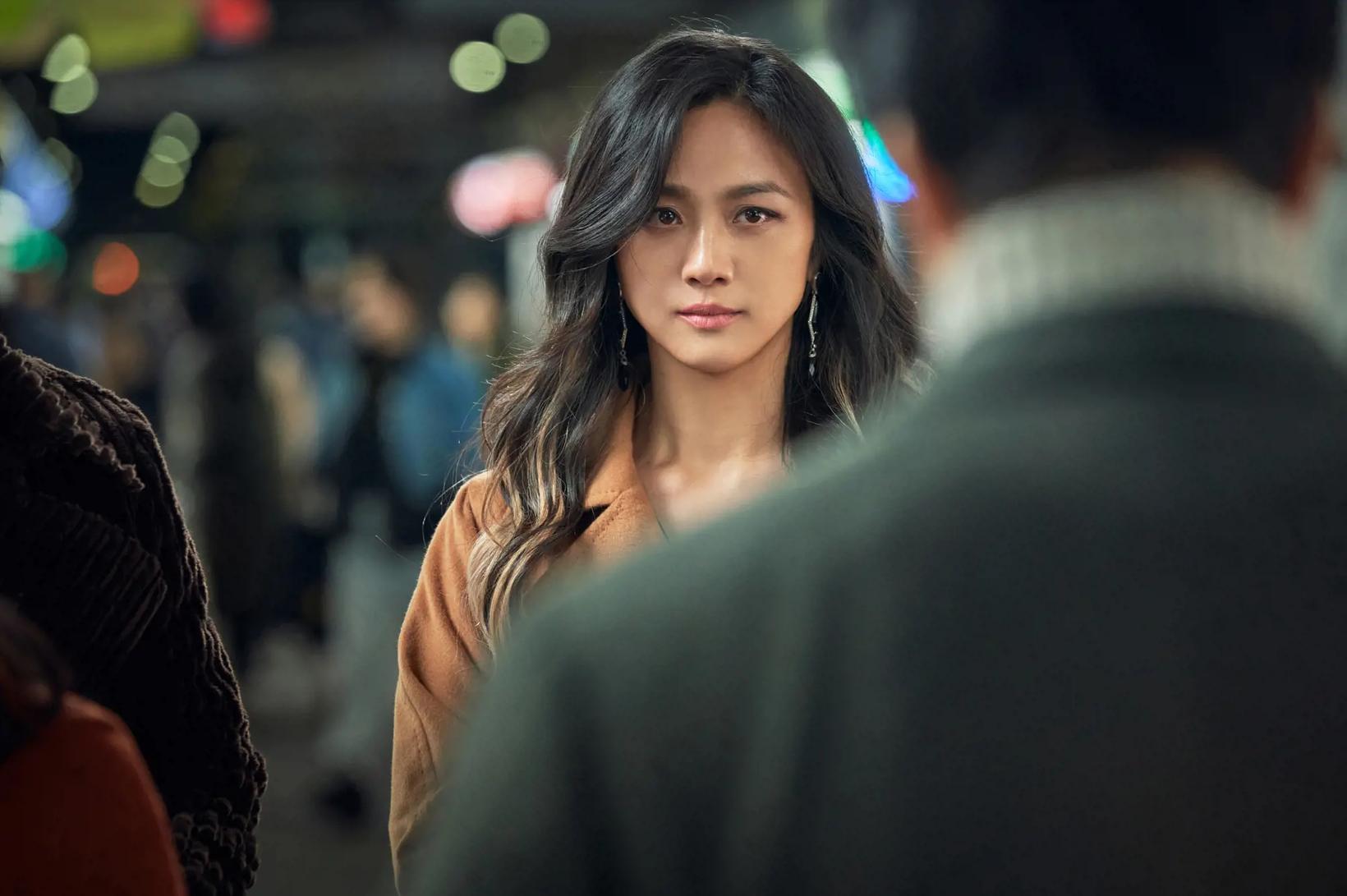 Tang Wei looking at something