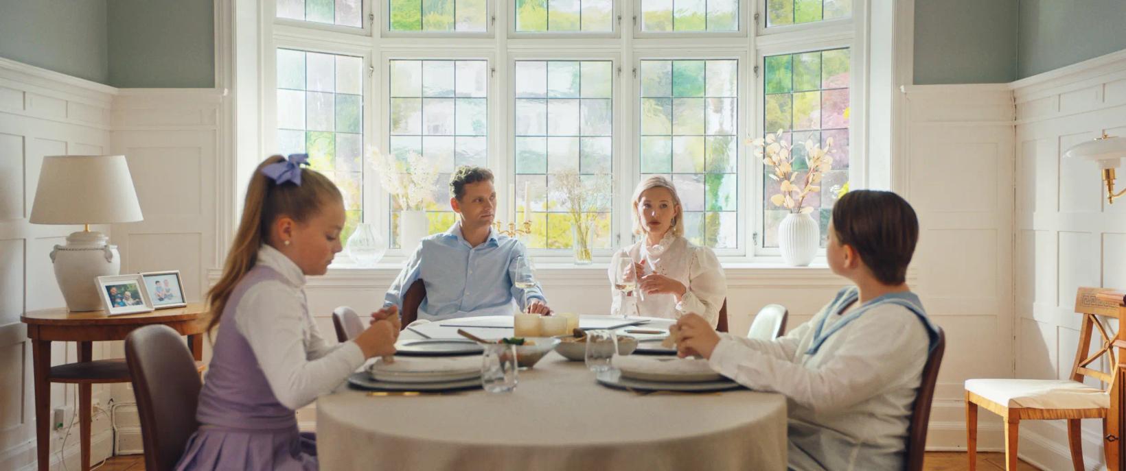a group of people sitting around a table