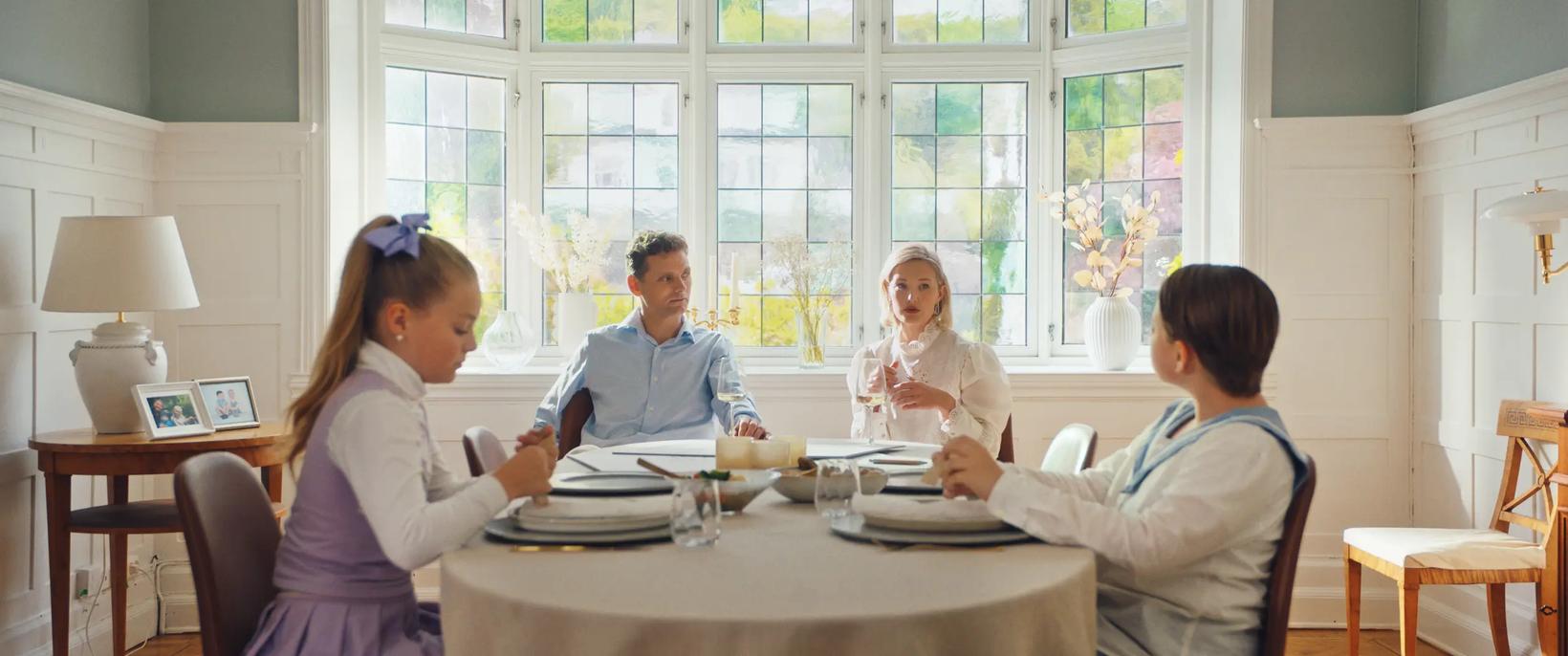 a group of people sitting around a table