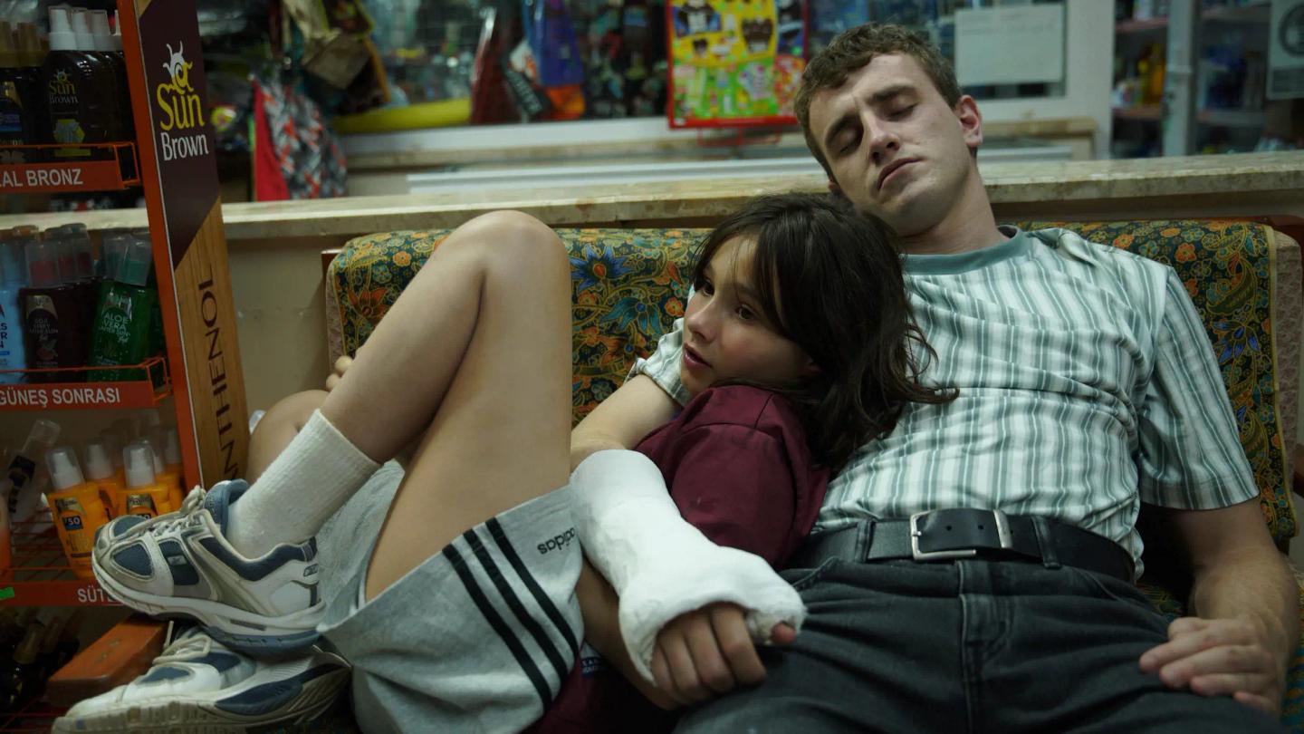 a man and a woman sitting on a couch in a store